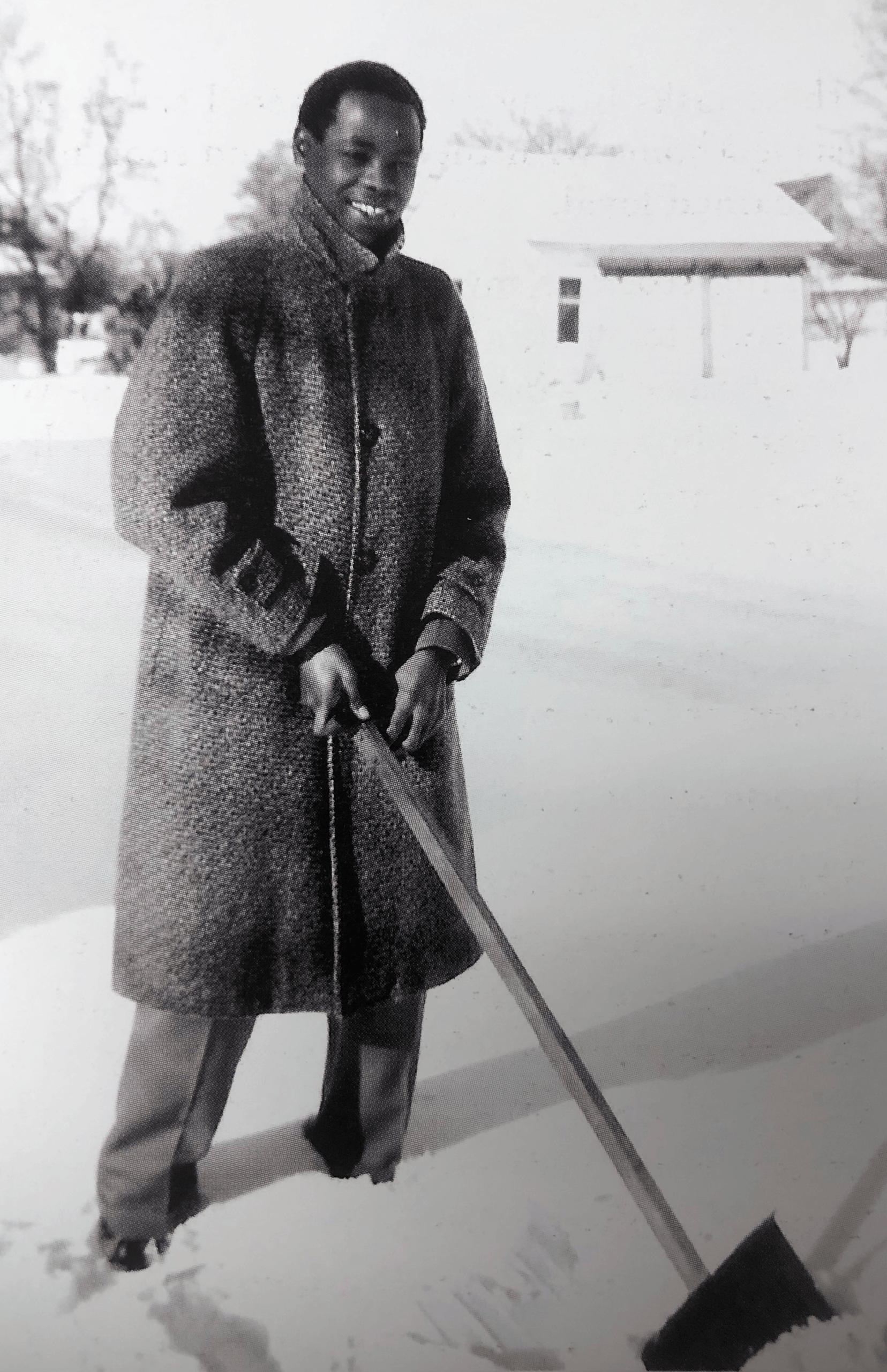 BGSU alumnus James B. Karugu holds a snow shovel in the early 1960s. 