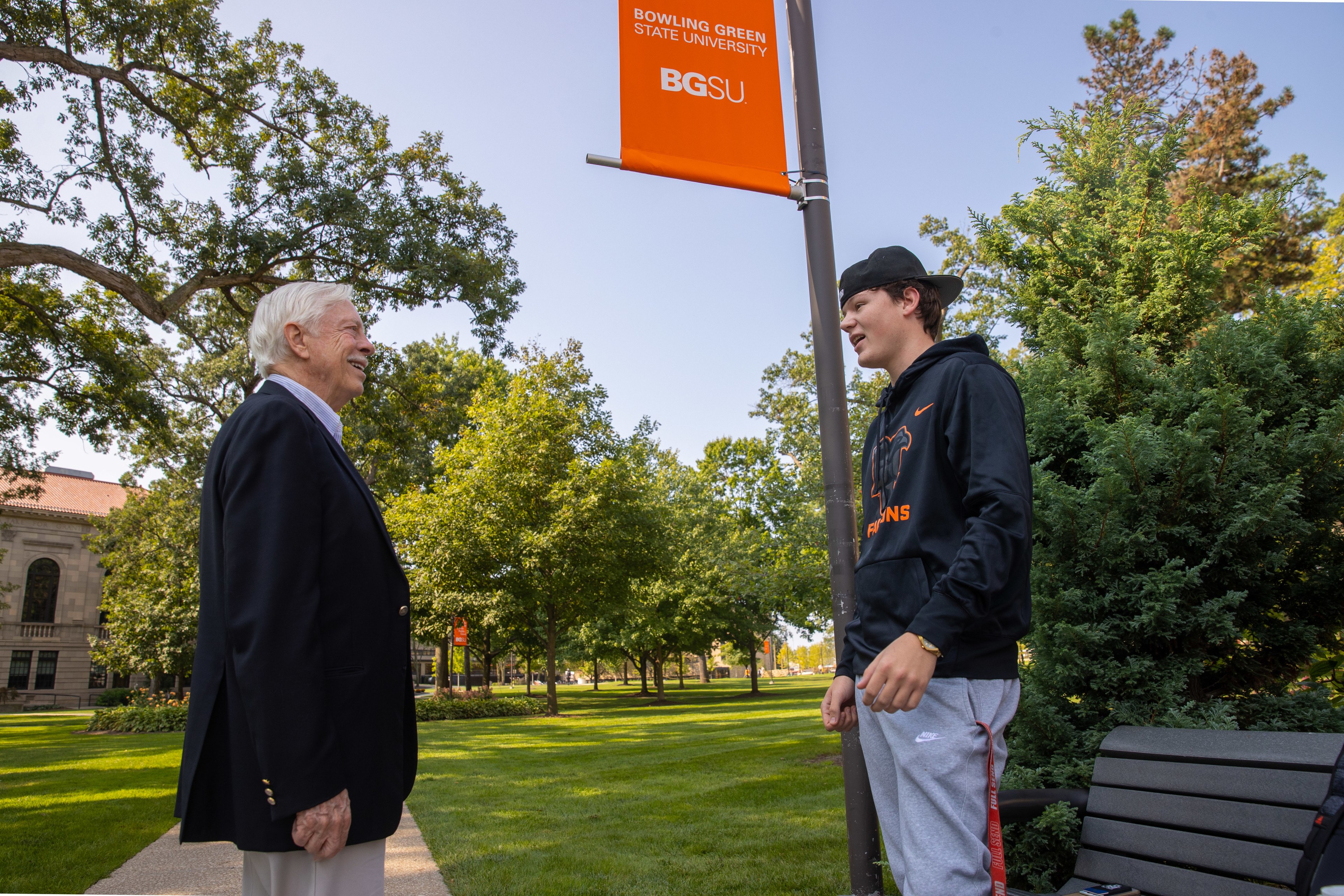 BGSU alumnus C. Raymond Marvin speaks with a student on campus 