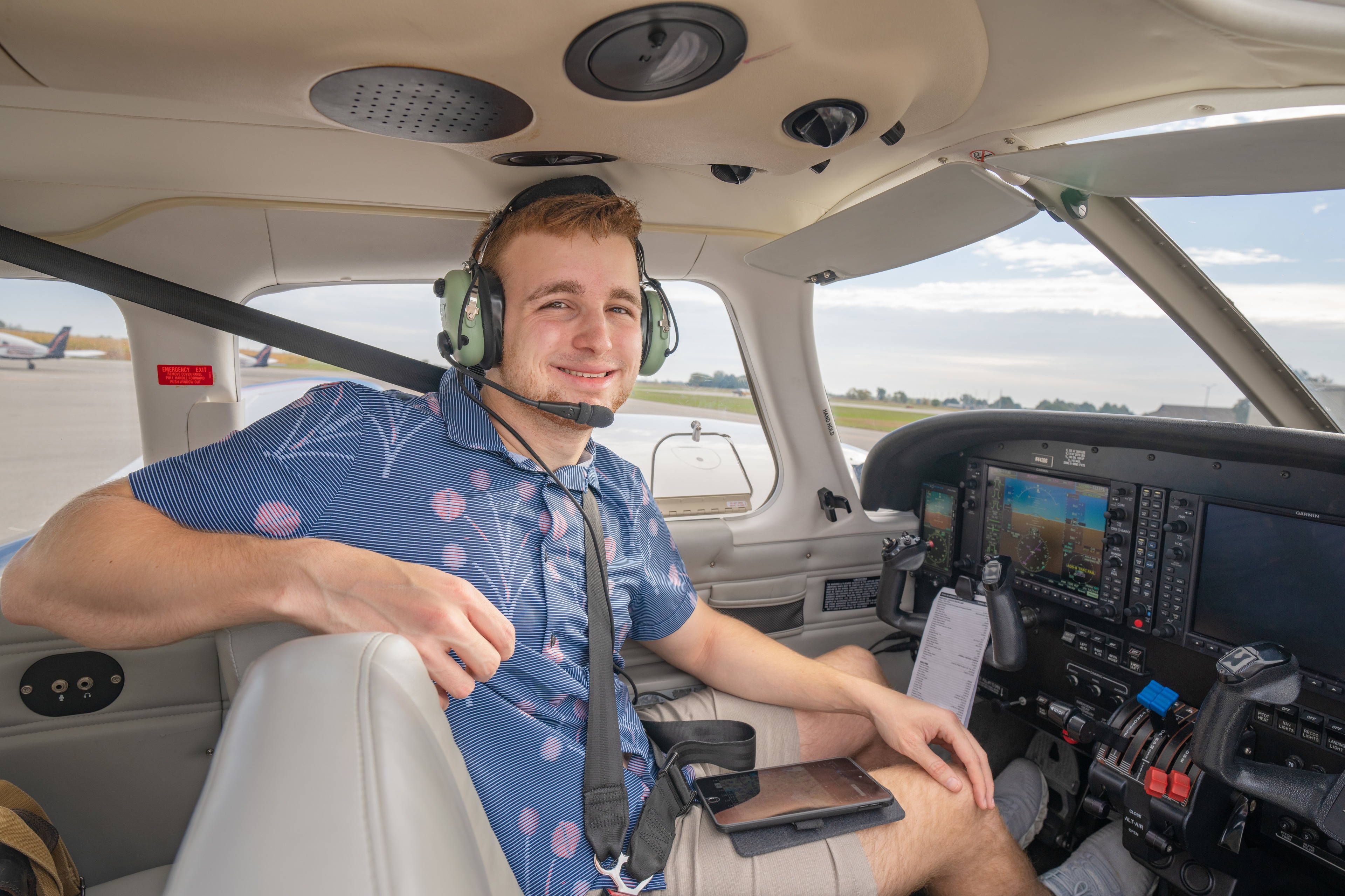 BGSU student Mason Manns sits at the controls of an airplane