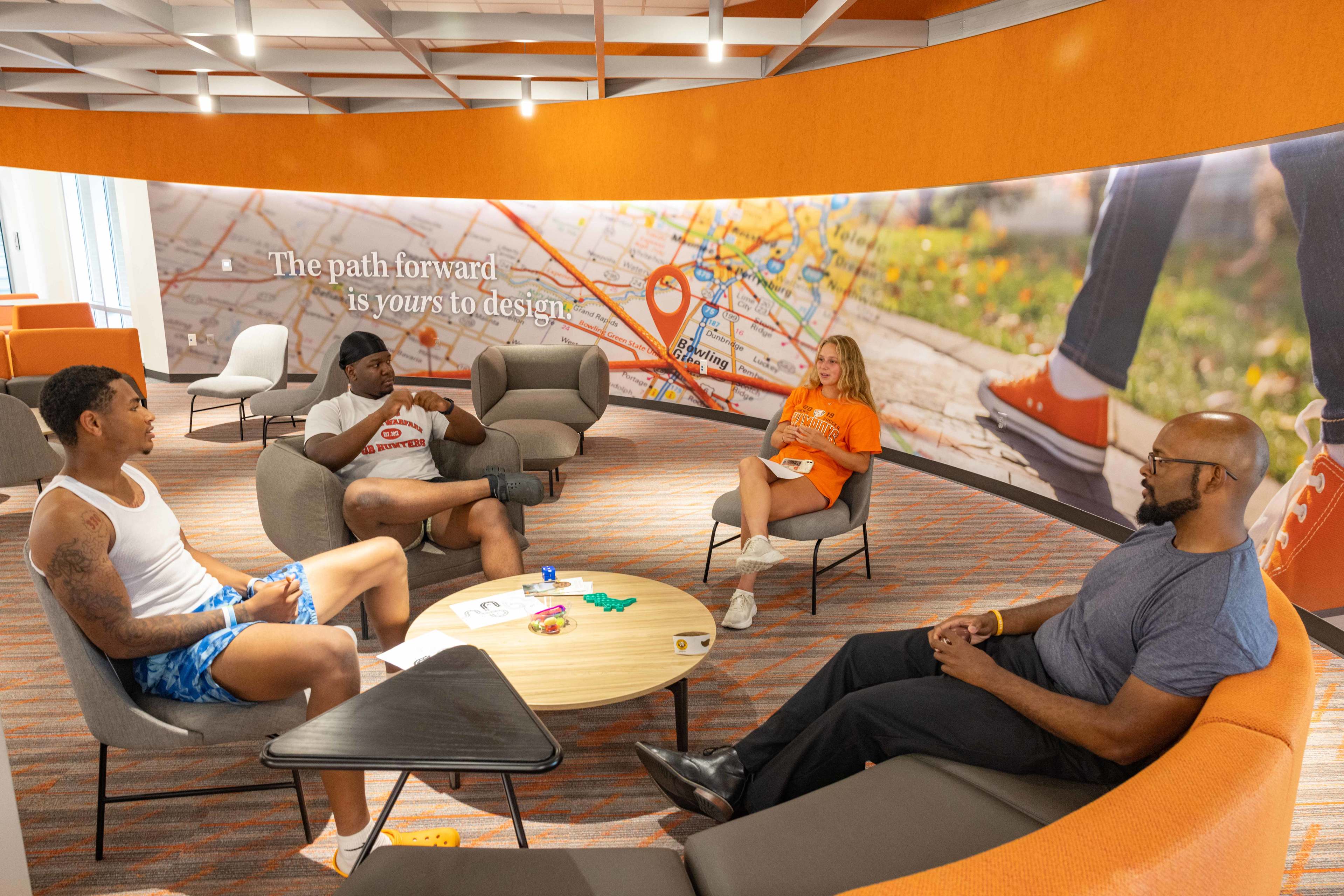 A group of people sitting in chairs at the BGSU Radbill Center for College and Life Design.