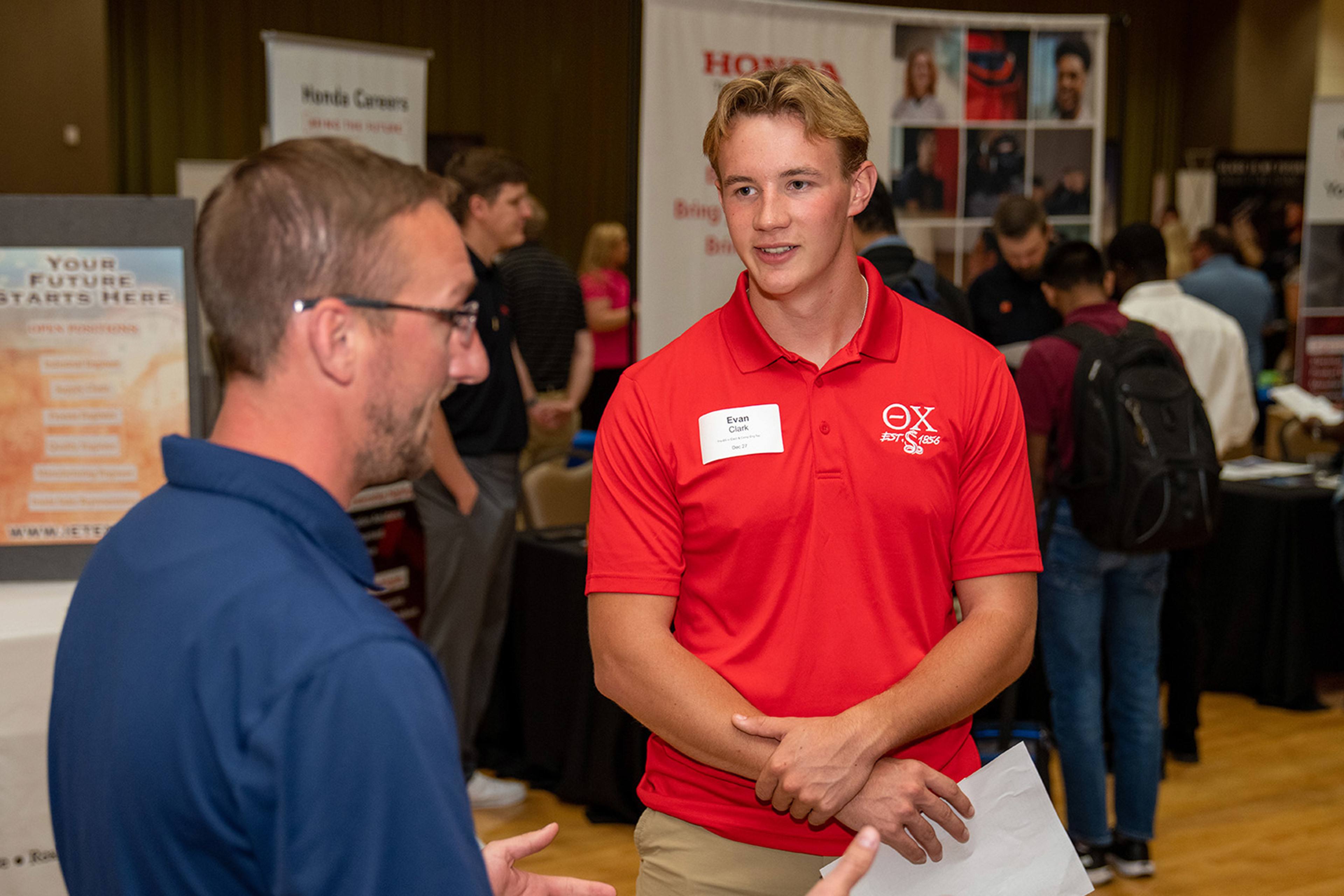 An employer talking to a BGSU student at the Kuhlin Hub Career EXPO Week.