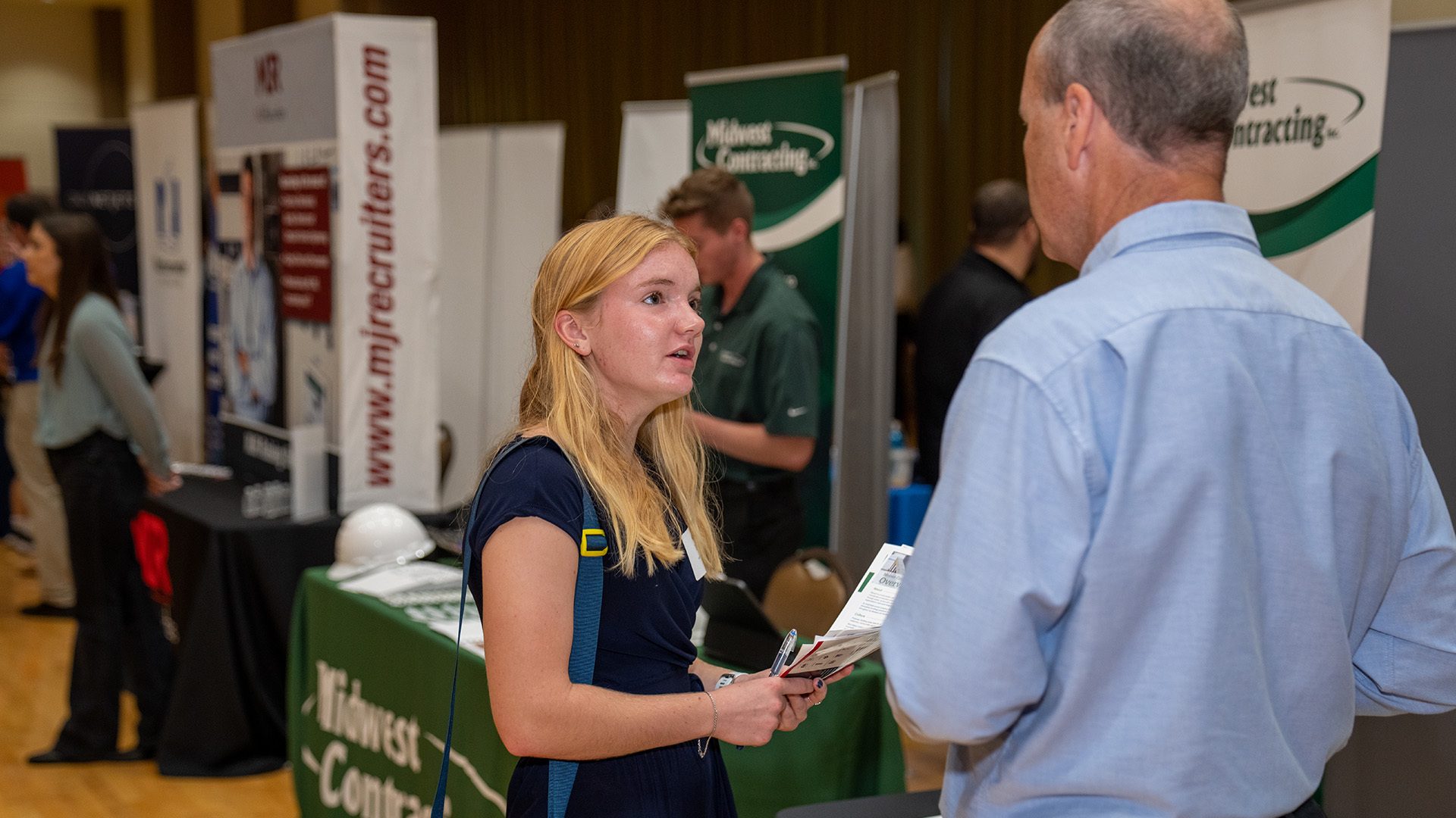 A BGSU student talking to an employer at the Kuhlin Hub Career EXPO Week.