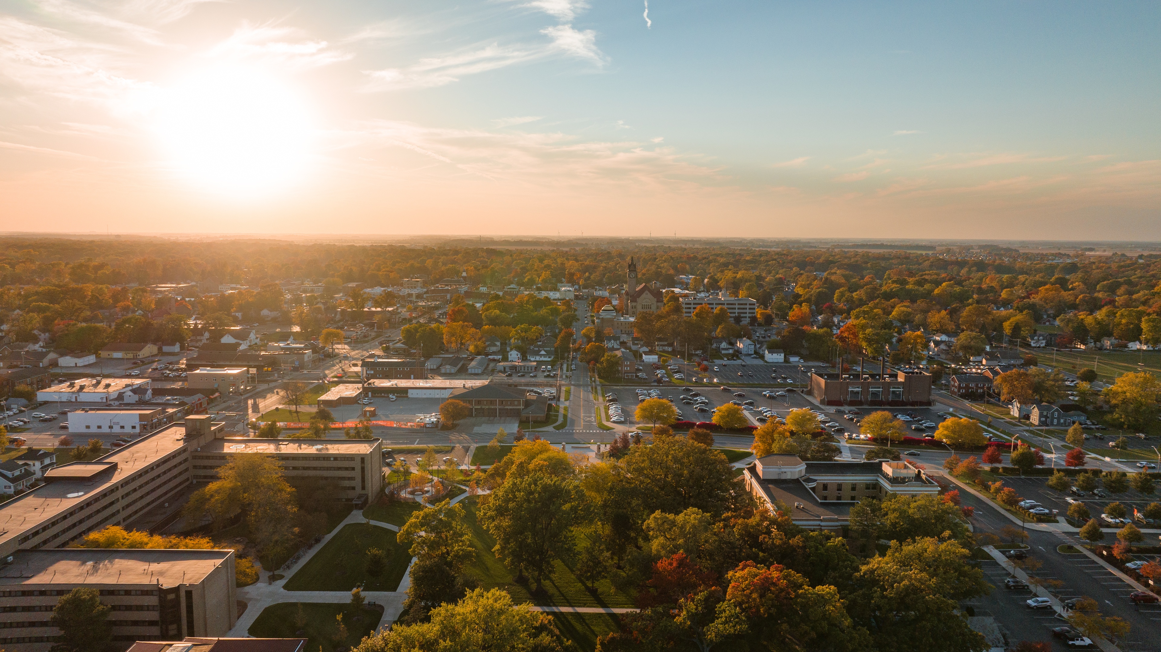 Aerial view of campus through downtown Bowling Green, taken by drone above University Hall