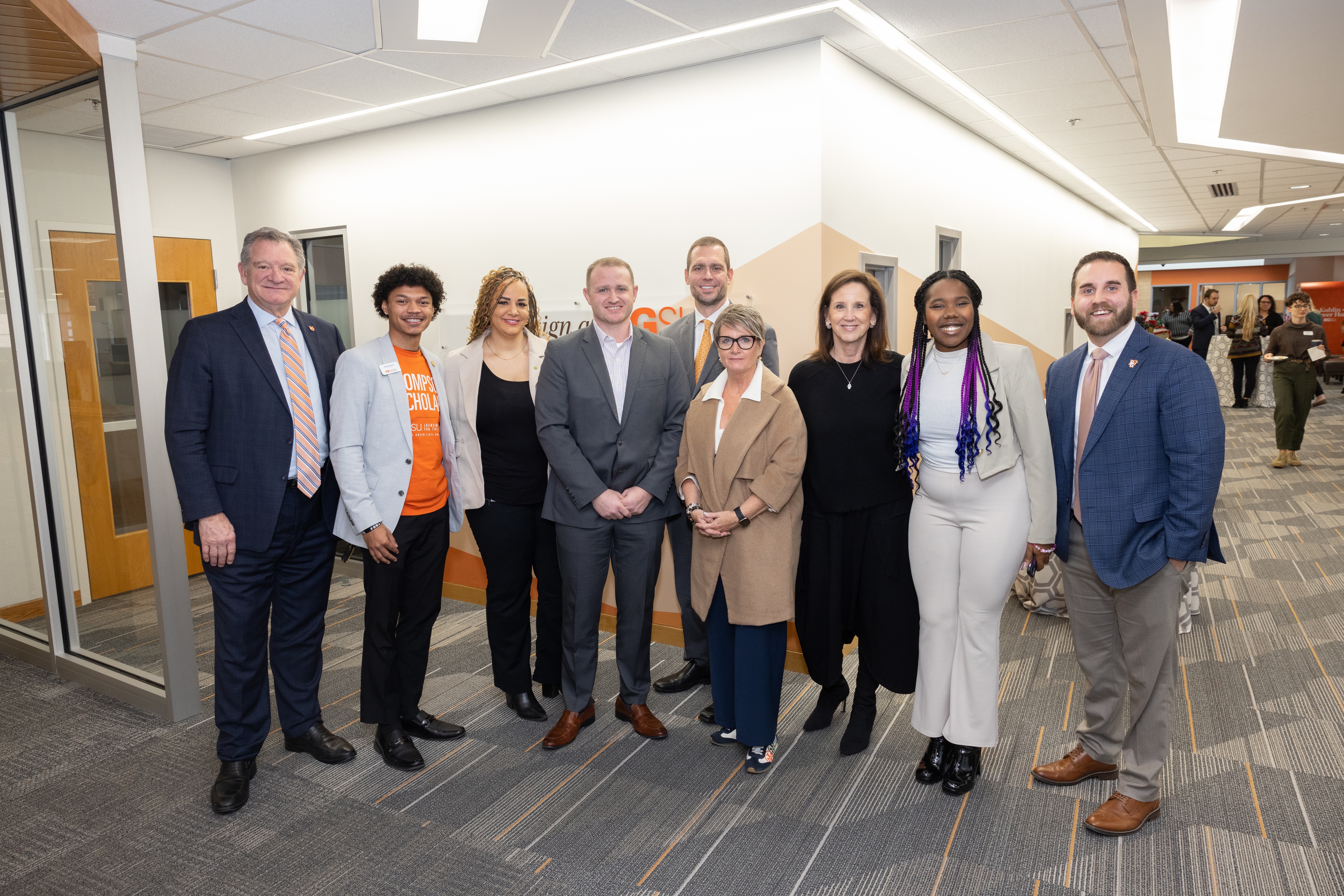 A group of people from BGSU and Huntington Bank smile during a celebration of the gift.