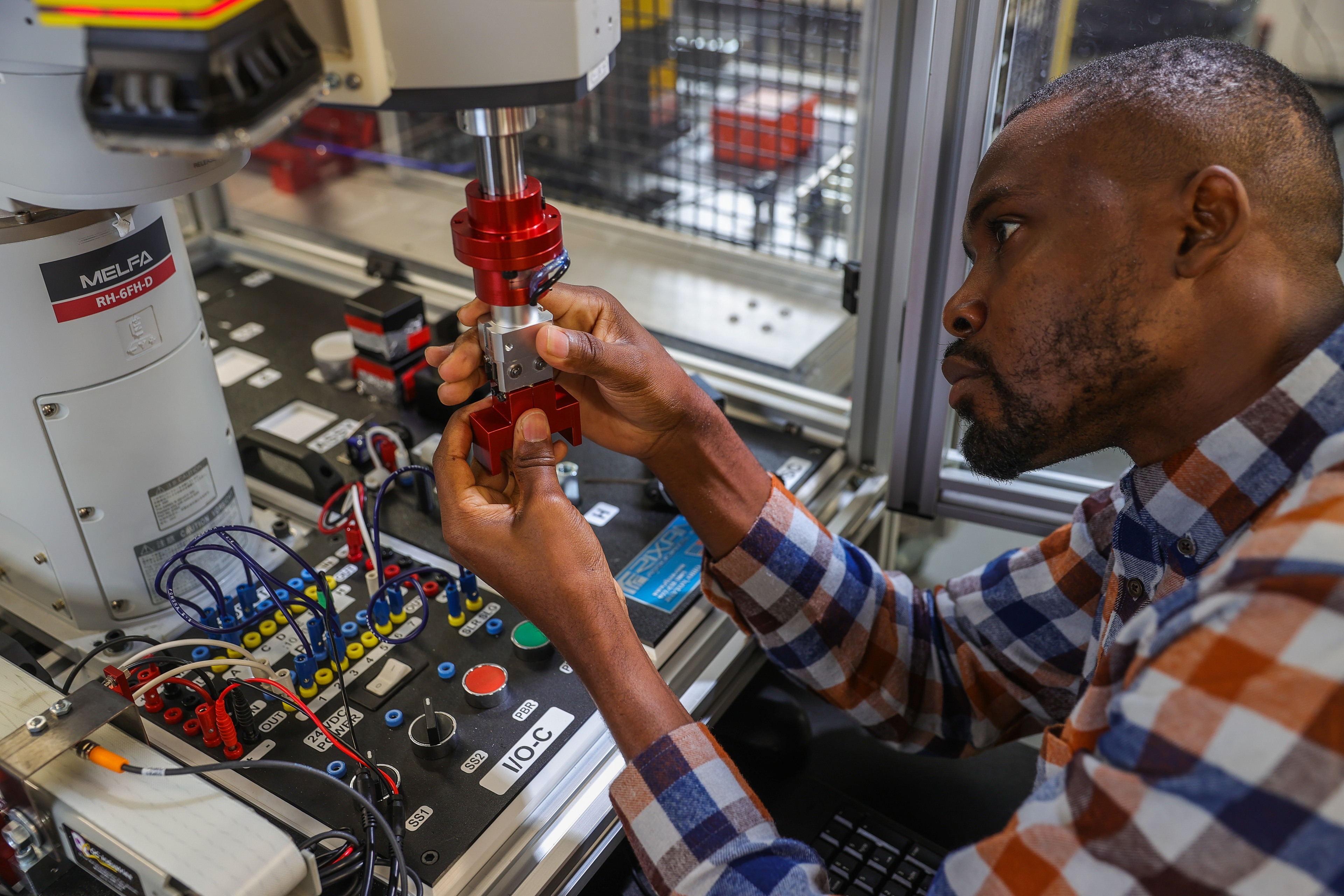 A BGSU student works on a robot in a hands-on lab in the College of Technology, Architecture and Applied Engineering.