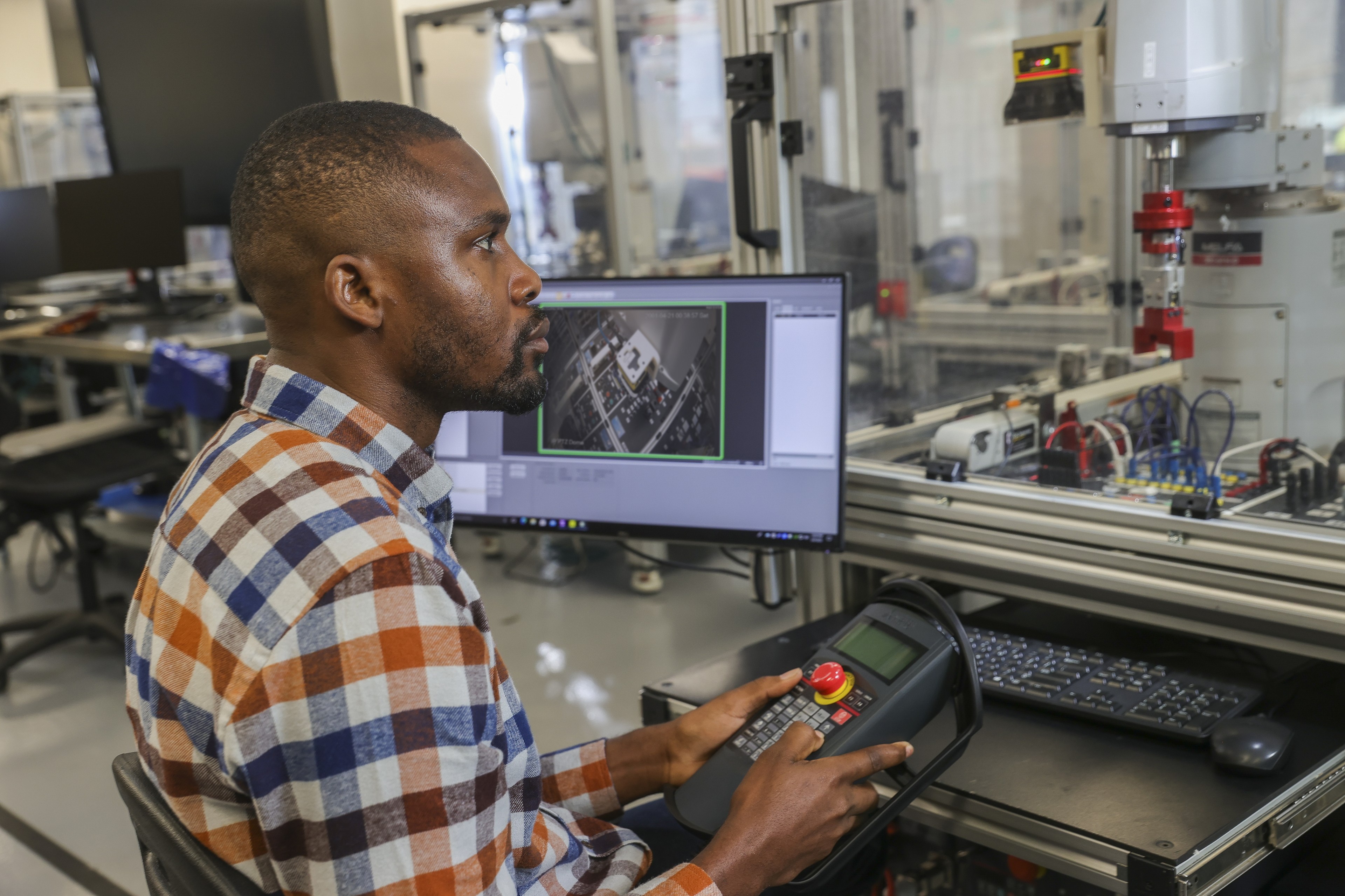 A person in a mechatronics engineering lab at BGSU.