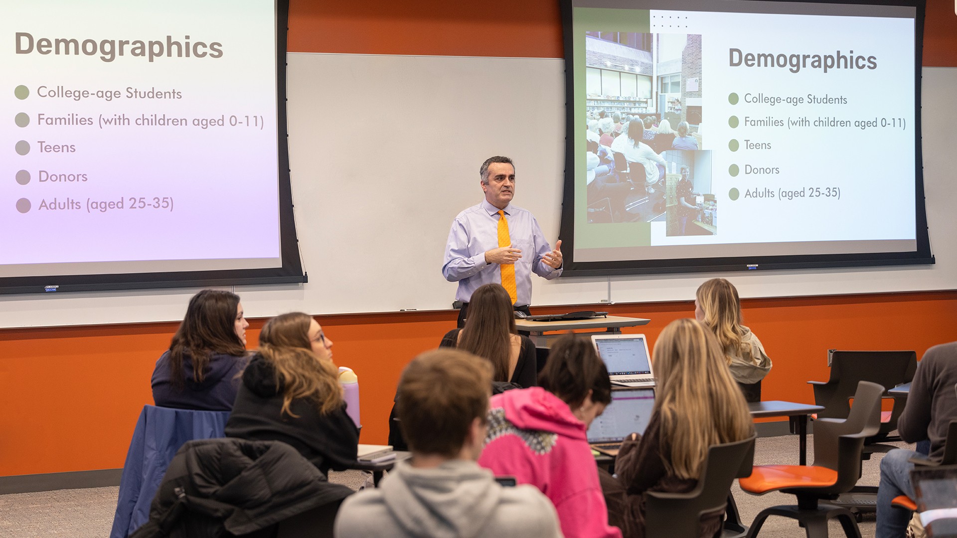 A BGSU associate professor giving a presentation to a group of students. 