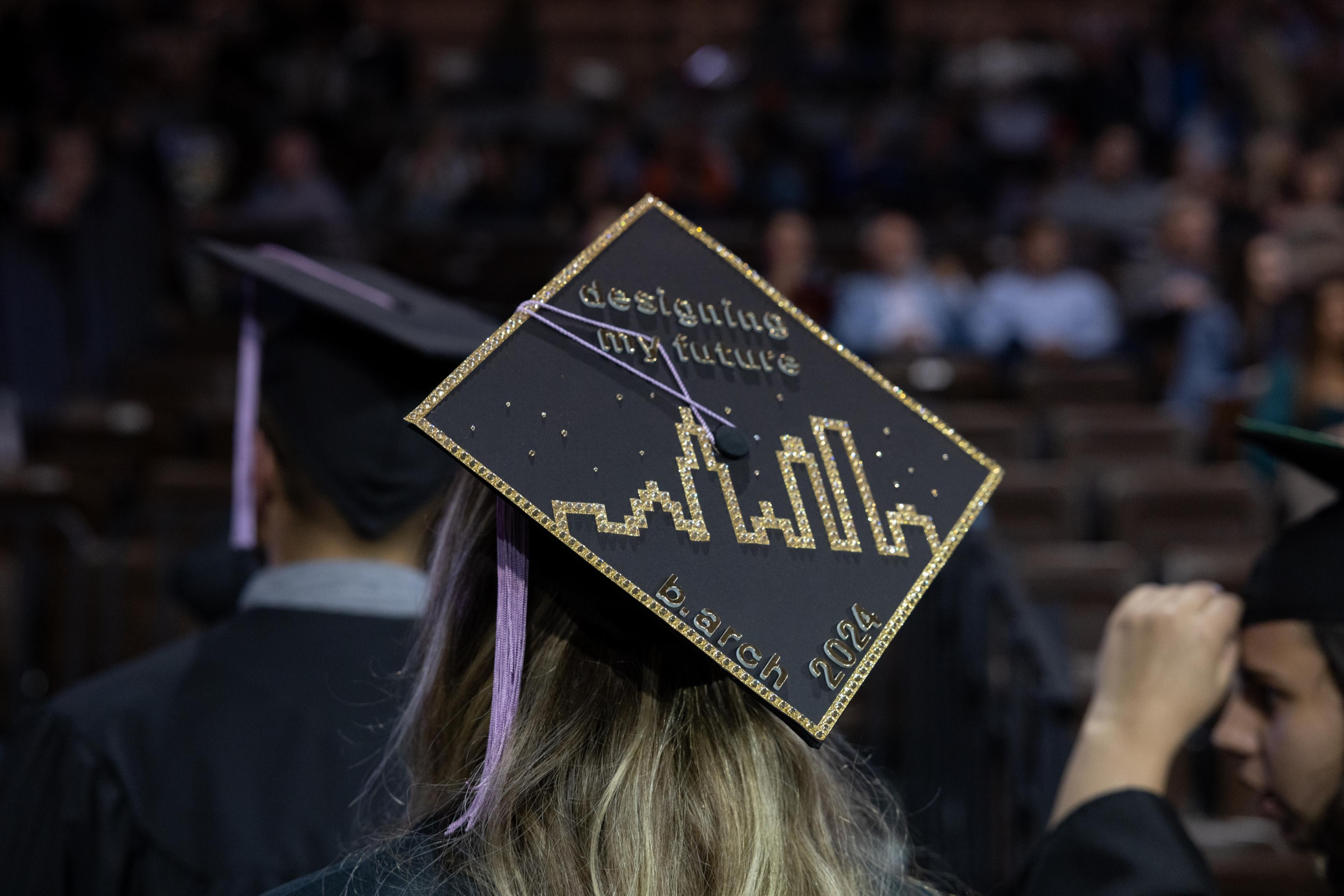 Architecture graduation caps says "Designing my future"