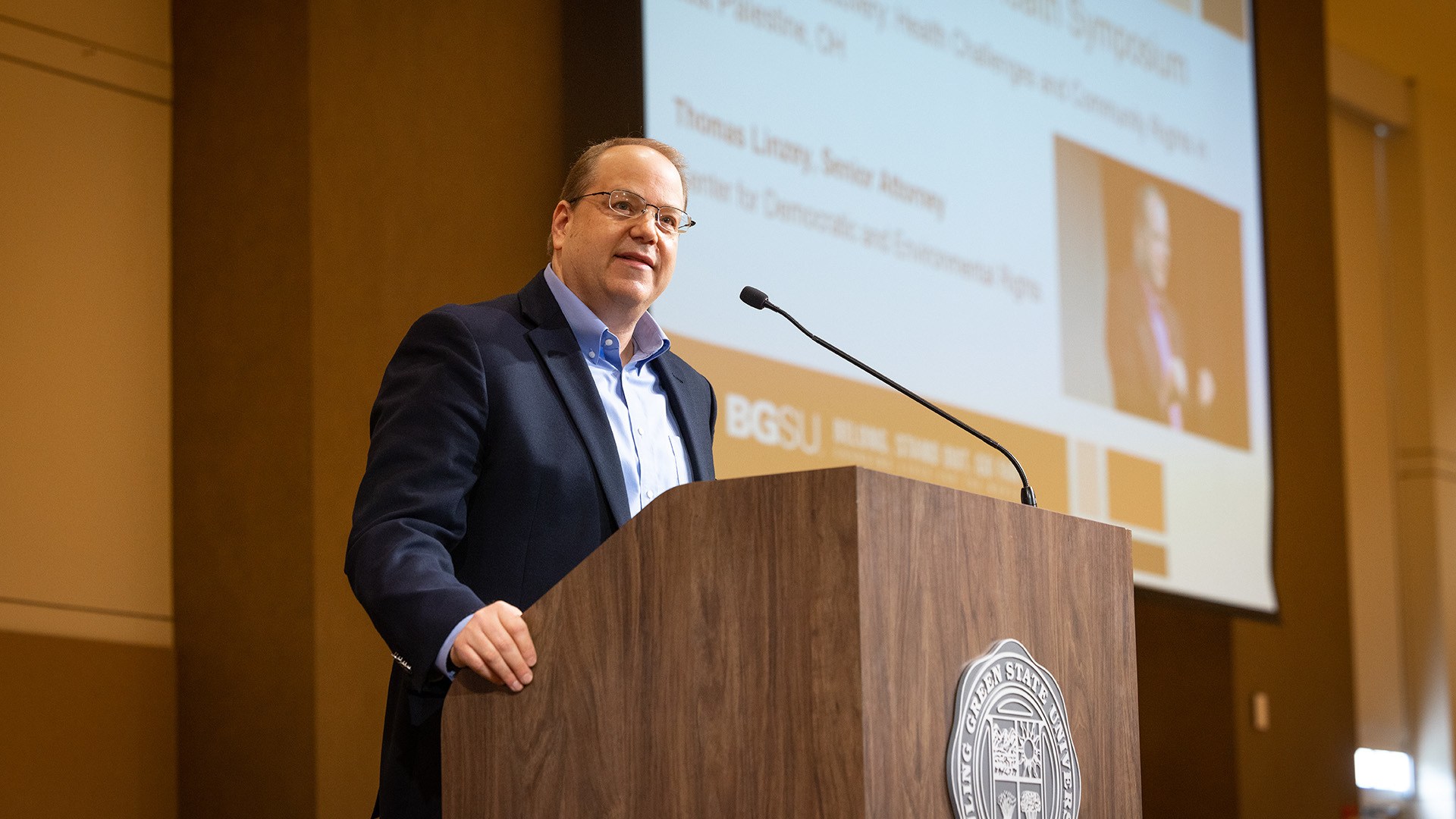 A man stands at a podium and gives a speech