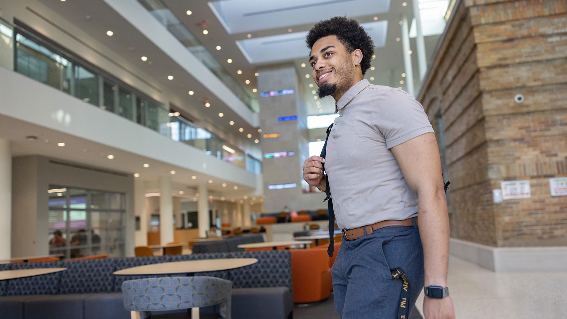 A person walks through the Maurer Center in the BGSU Schmidthorst College of Business.