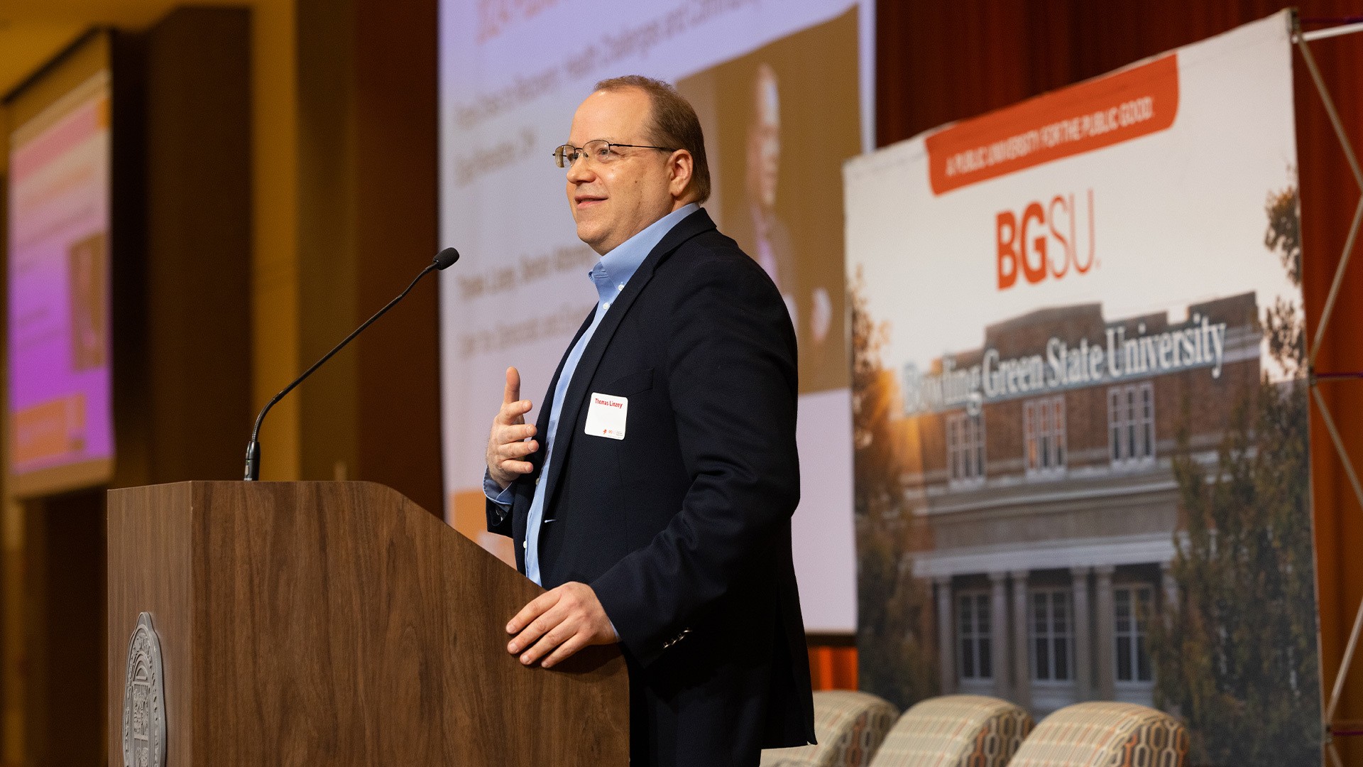 Man stands at a podium to give a speech