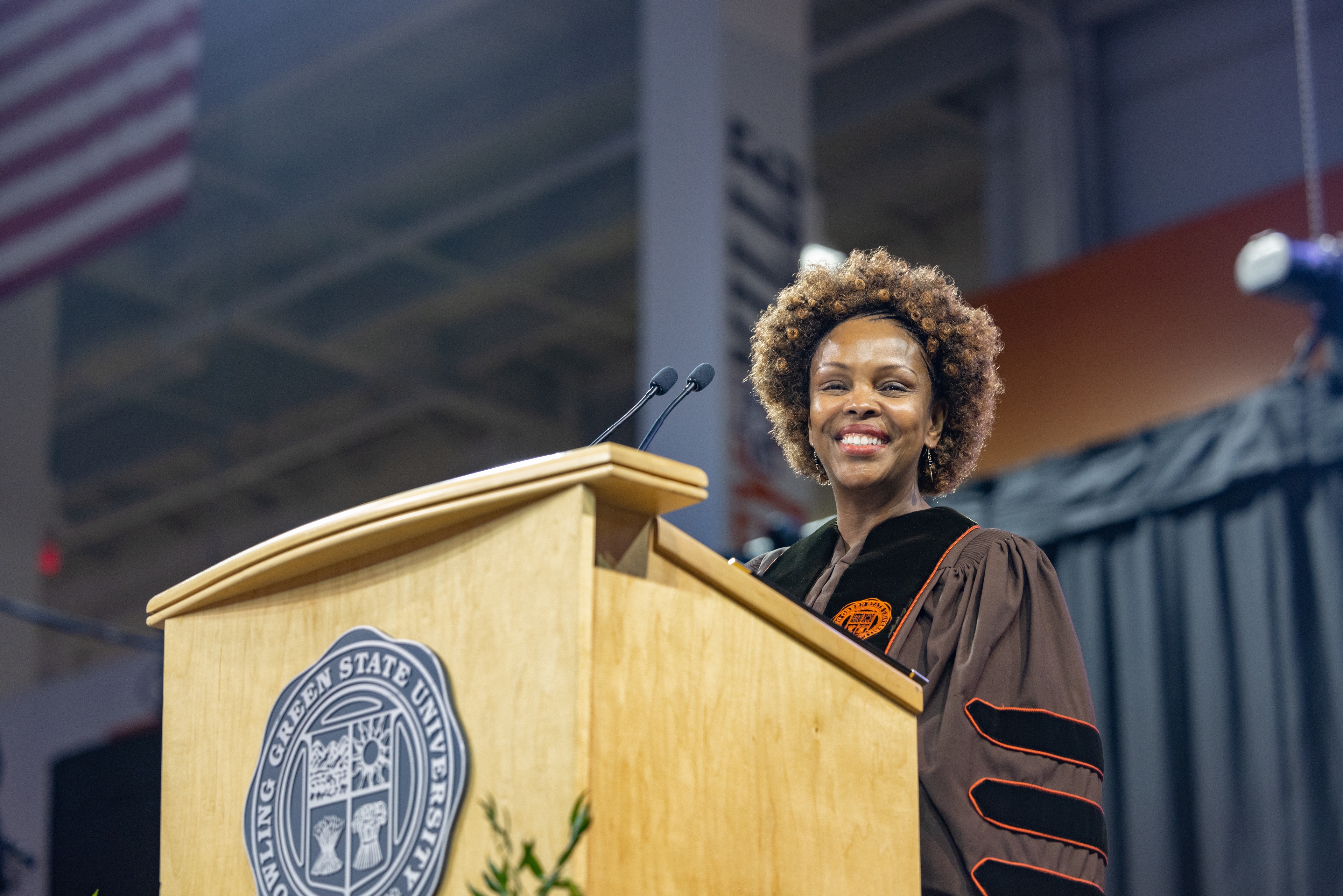 Vicky Karugu stands at a podium