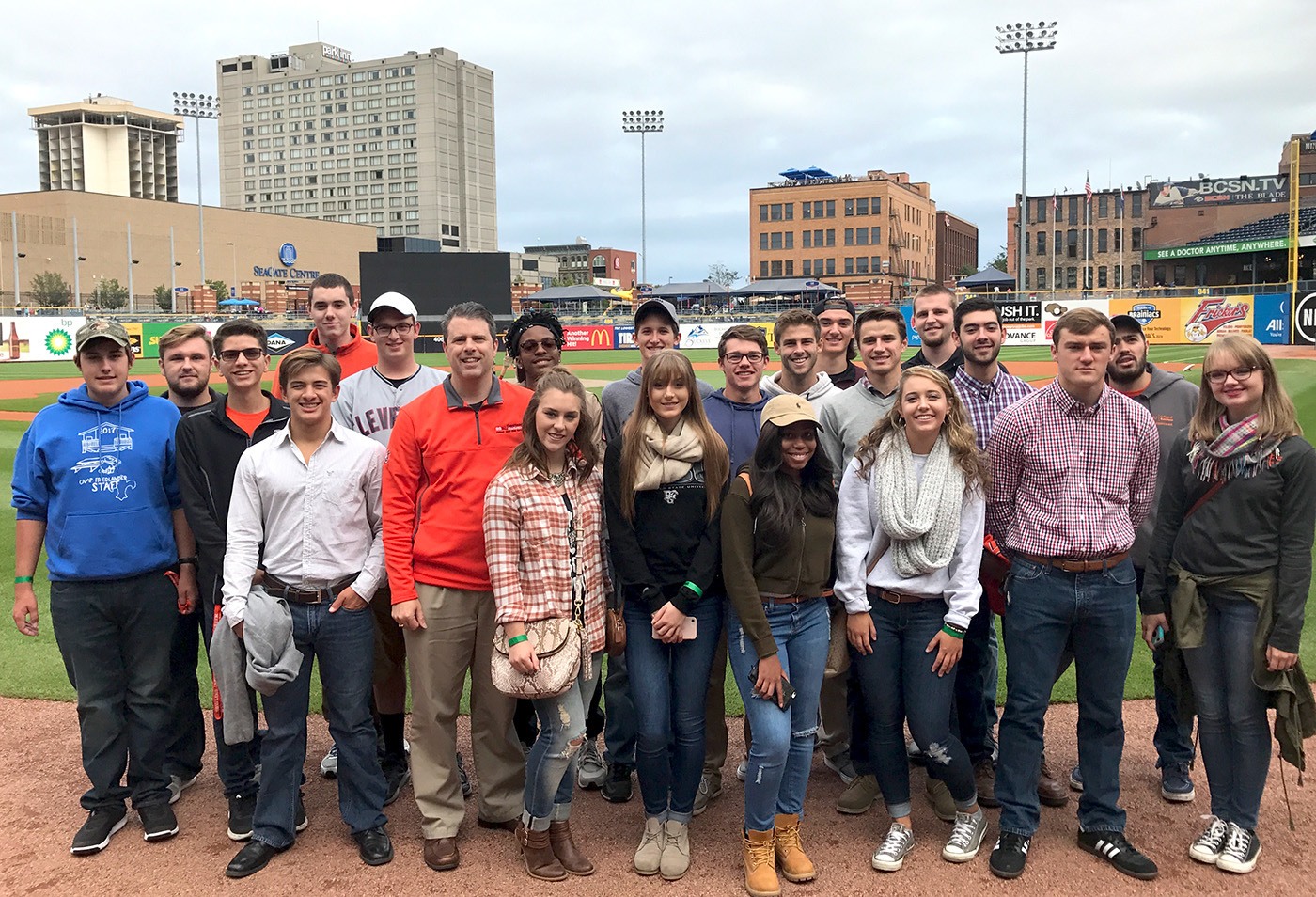 Students and faculty on baseball field