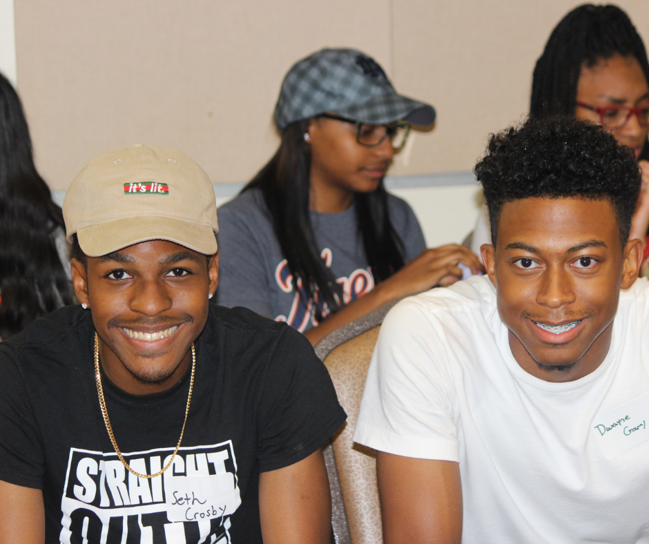 Two male students smiling at the camera