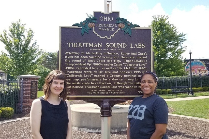 two BGSU students stand by Troutman Sound Labs Ohio historical marker