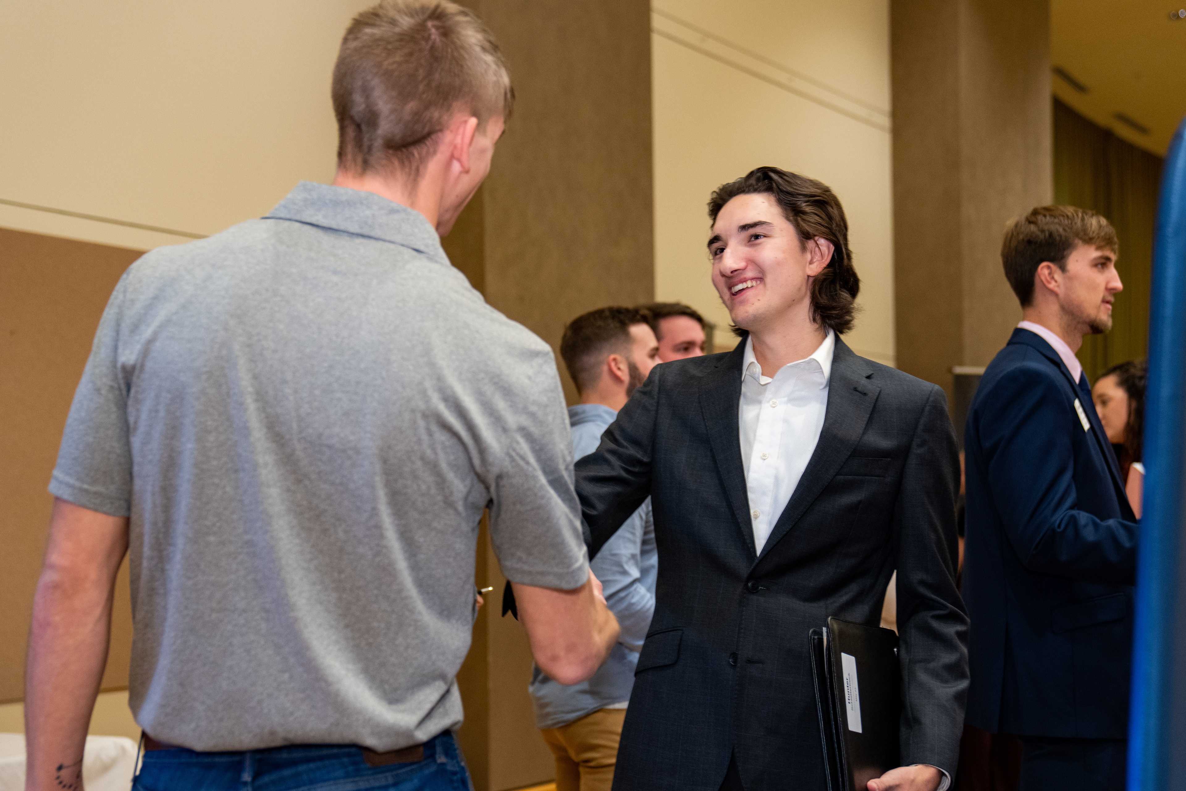 BGSU student shaking hands with employer at Career Expo