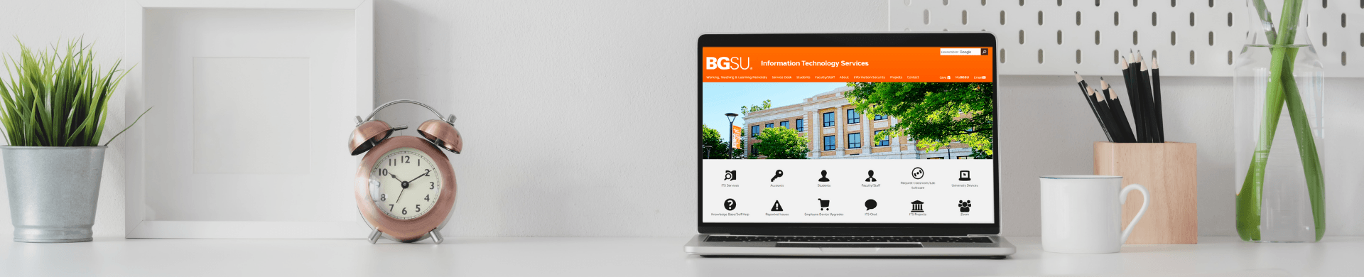page banner image of desk with laptop and bgsu its homepage on screen