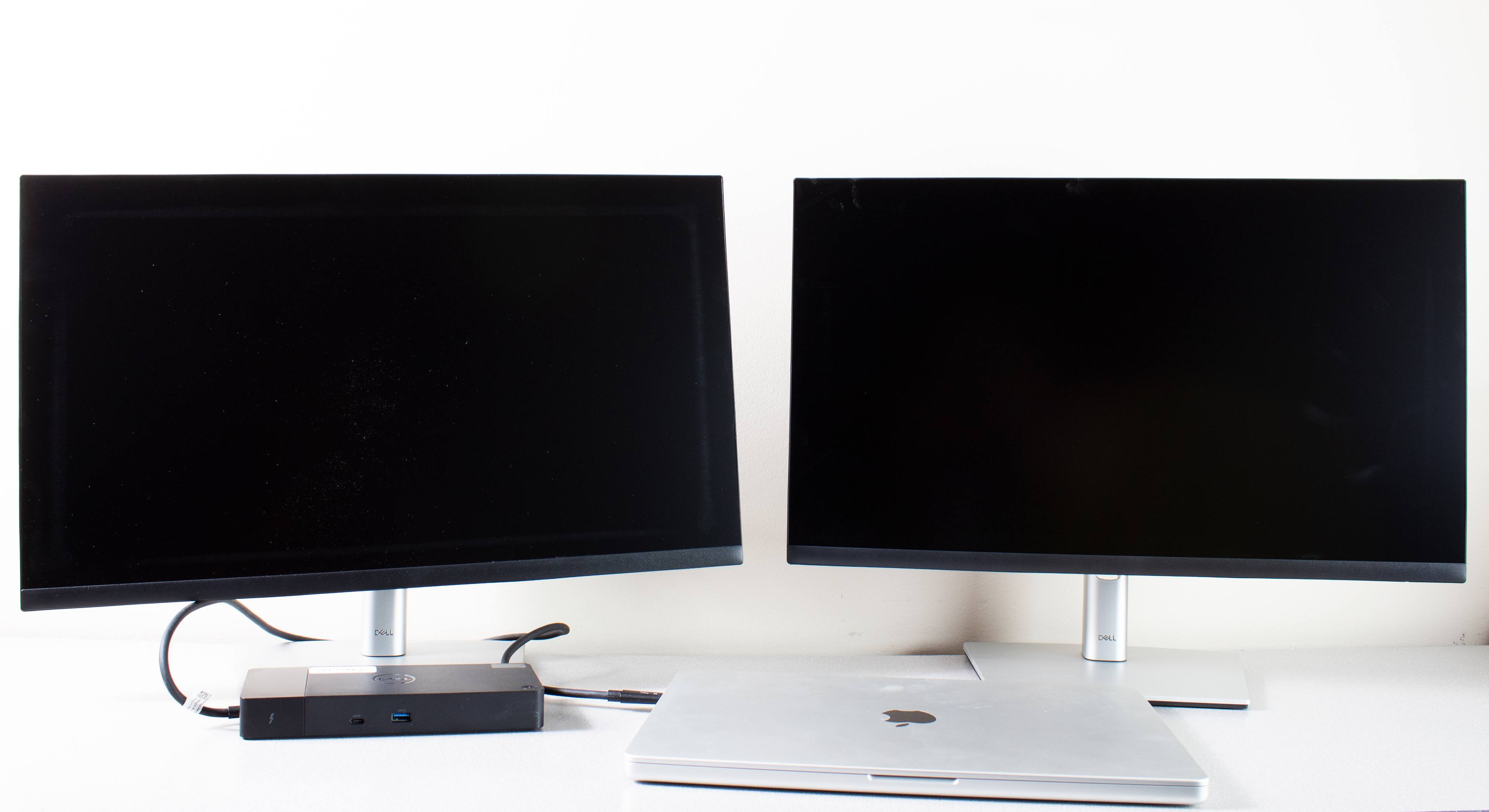 MacBook Pro laptop with two monitors