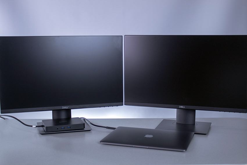 MacBook Air laptop with two monitors