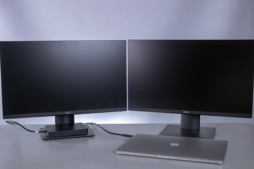 MacBook Pro laptop with two monitors