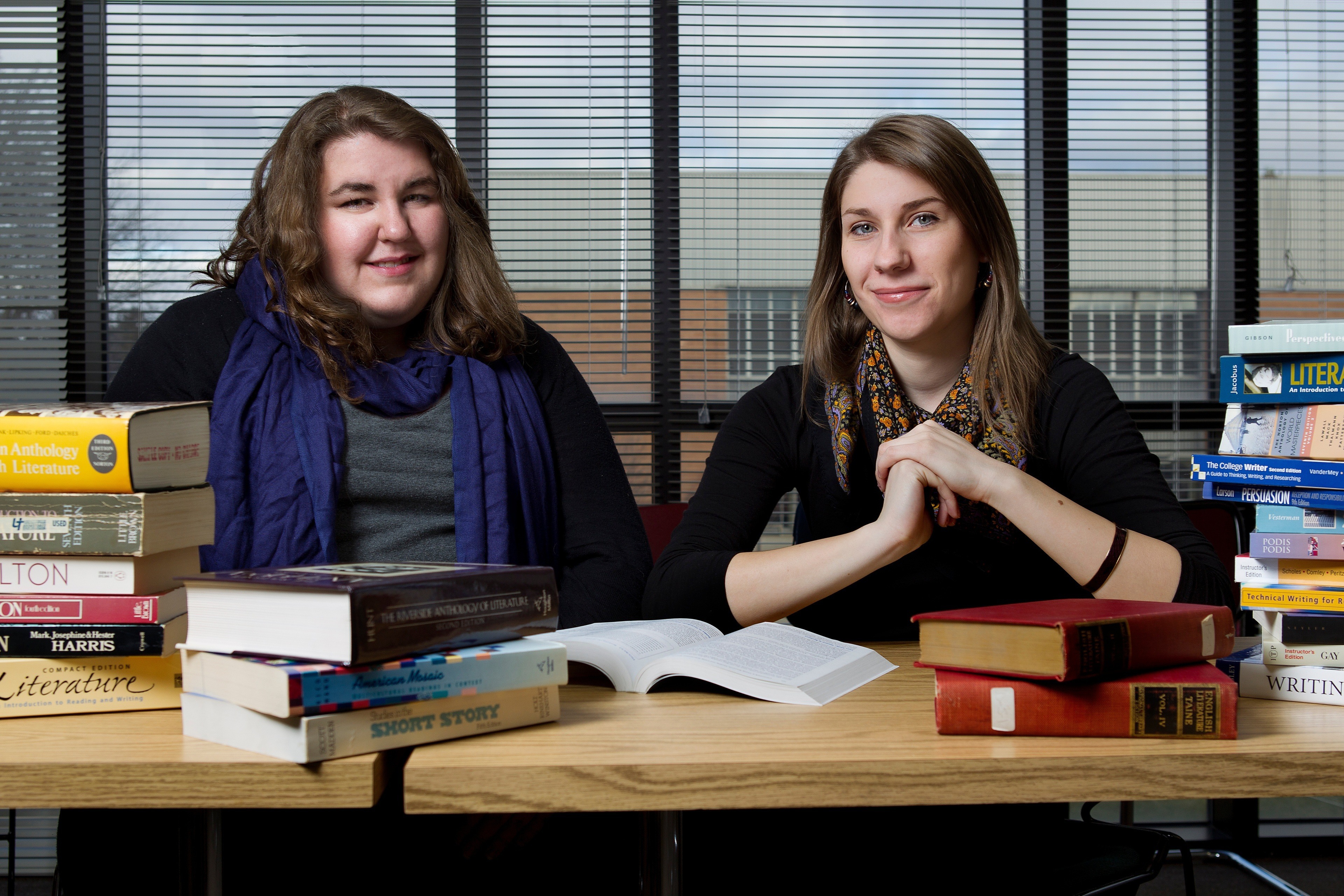 Two BGSU Engish students sitting at a desk with books