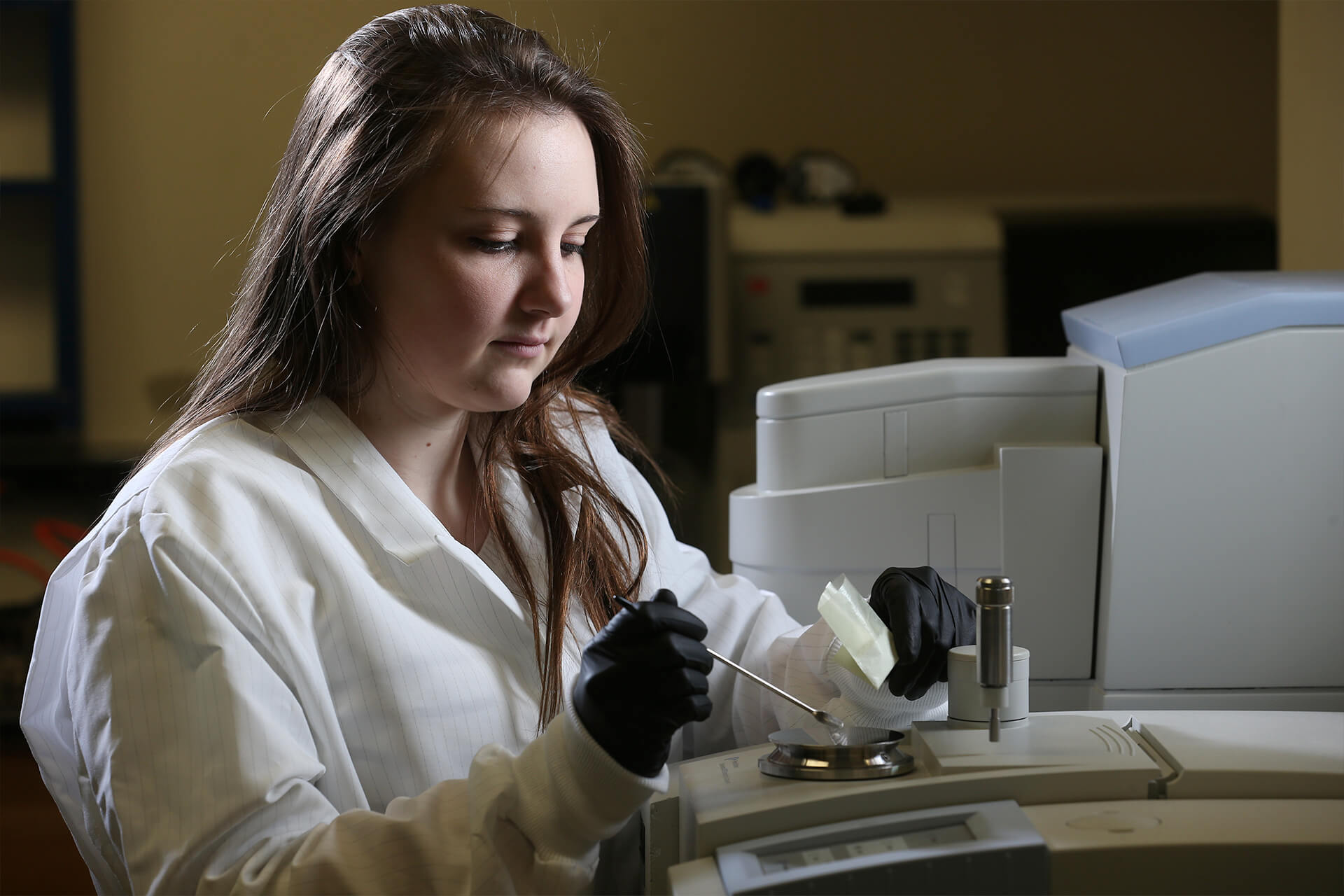 A BGSU forensic chemistry student examines forensic evidence in one of the Ohio based forensic labs.