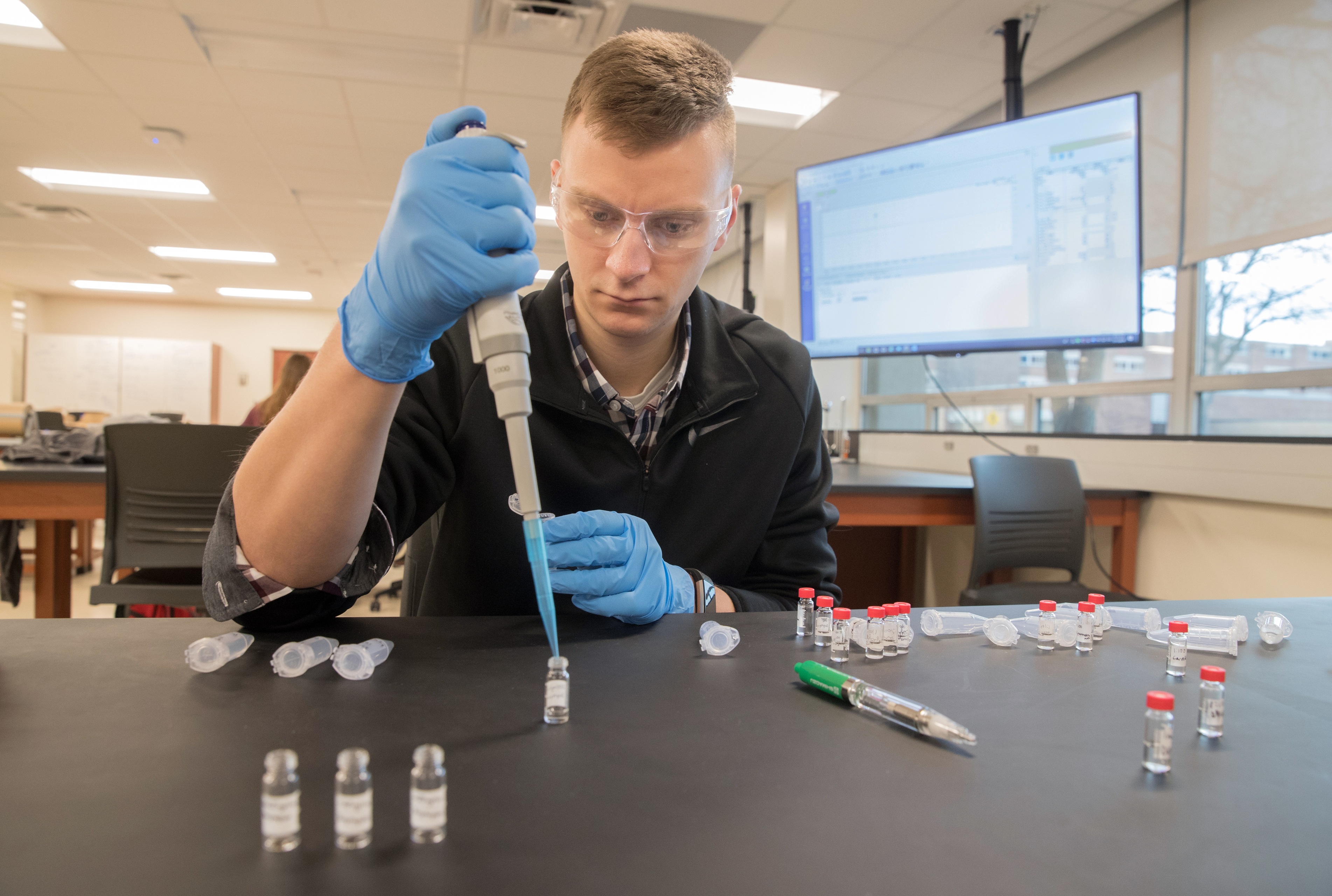The careful identification and analysis of the traces of crime occupy a BGSU Forensic Chemistry student in an Ohio lab.