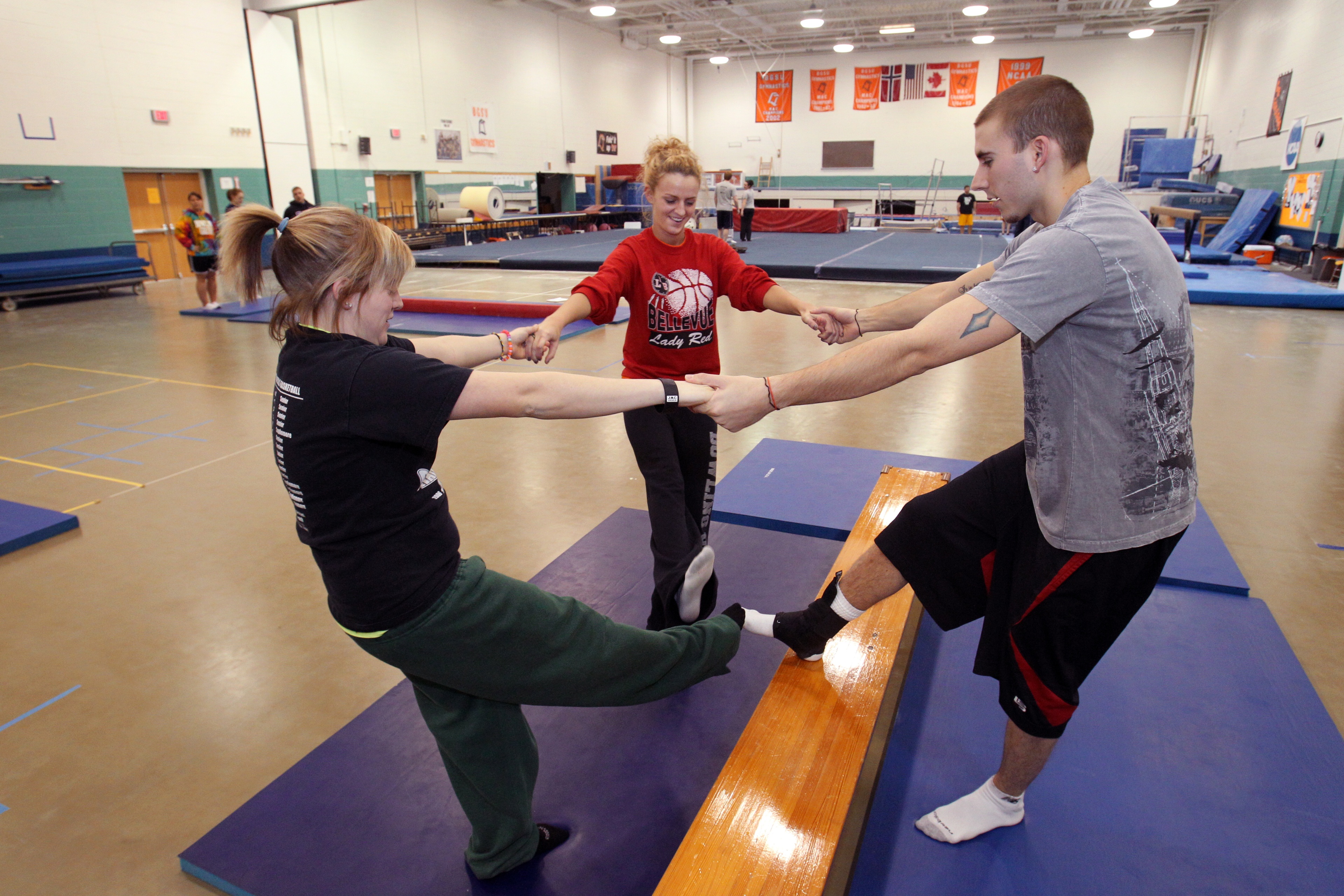 Three BGSU Kinesiology master's students practice strength exercises in a dedicated Fitness Center on our Ohio campus.