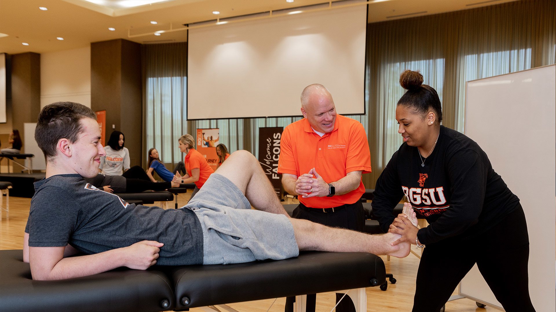 A Physical Therapy student testing foot reflexes