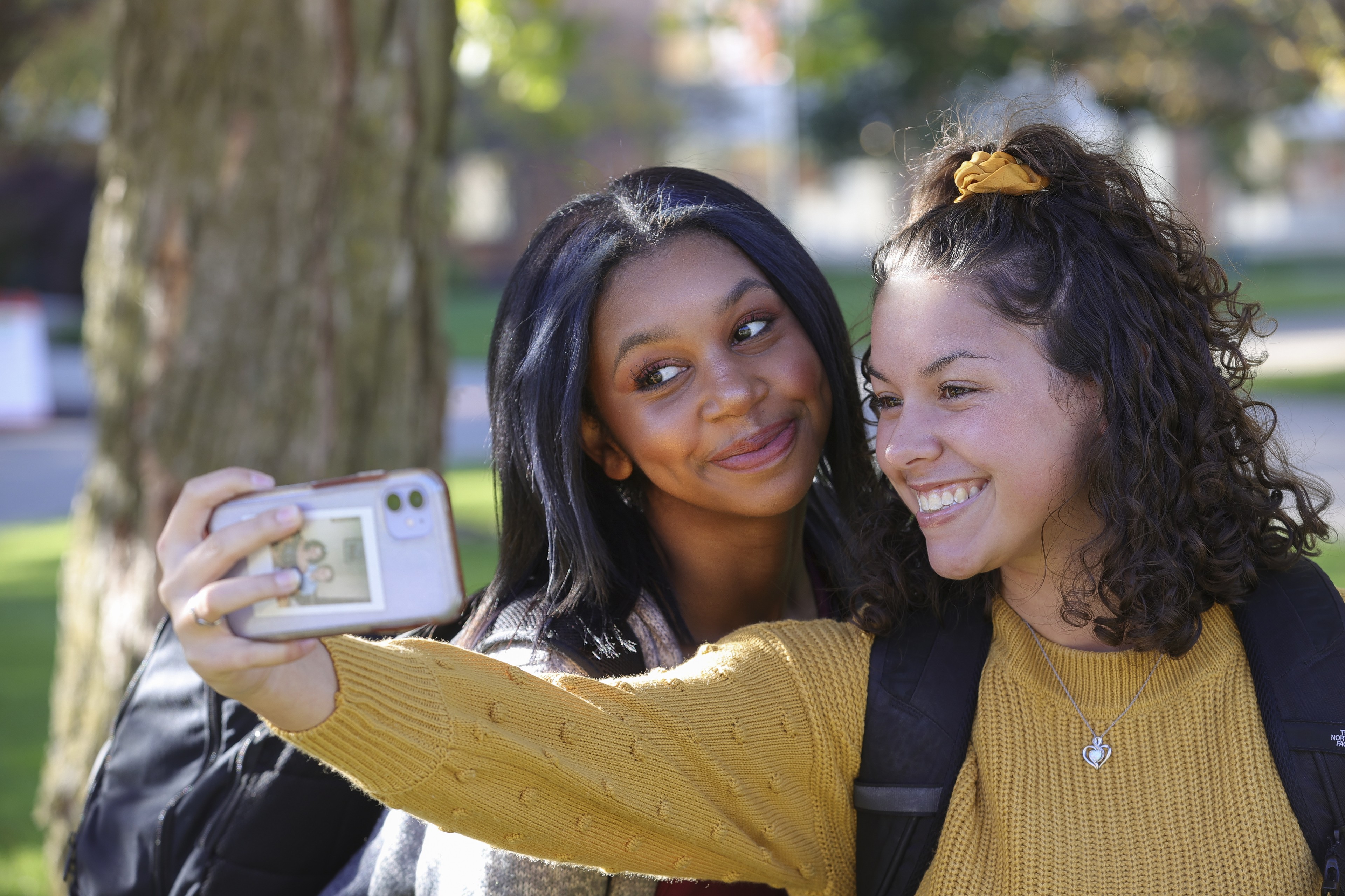 Two women taking a selfie. Cellphone habits are one phenomenon studied by BGSU graduate students in the popular culture program.