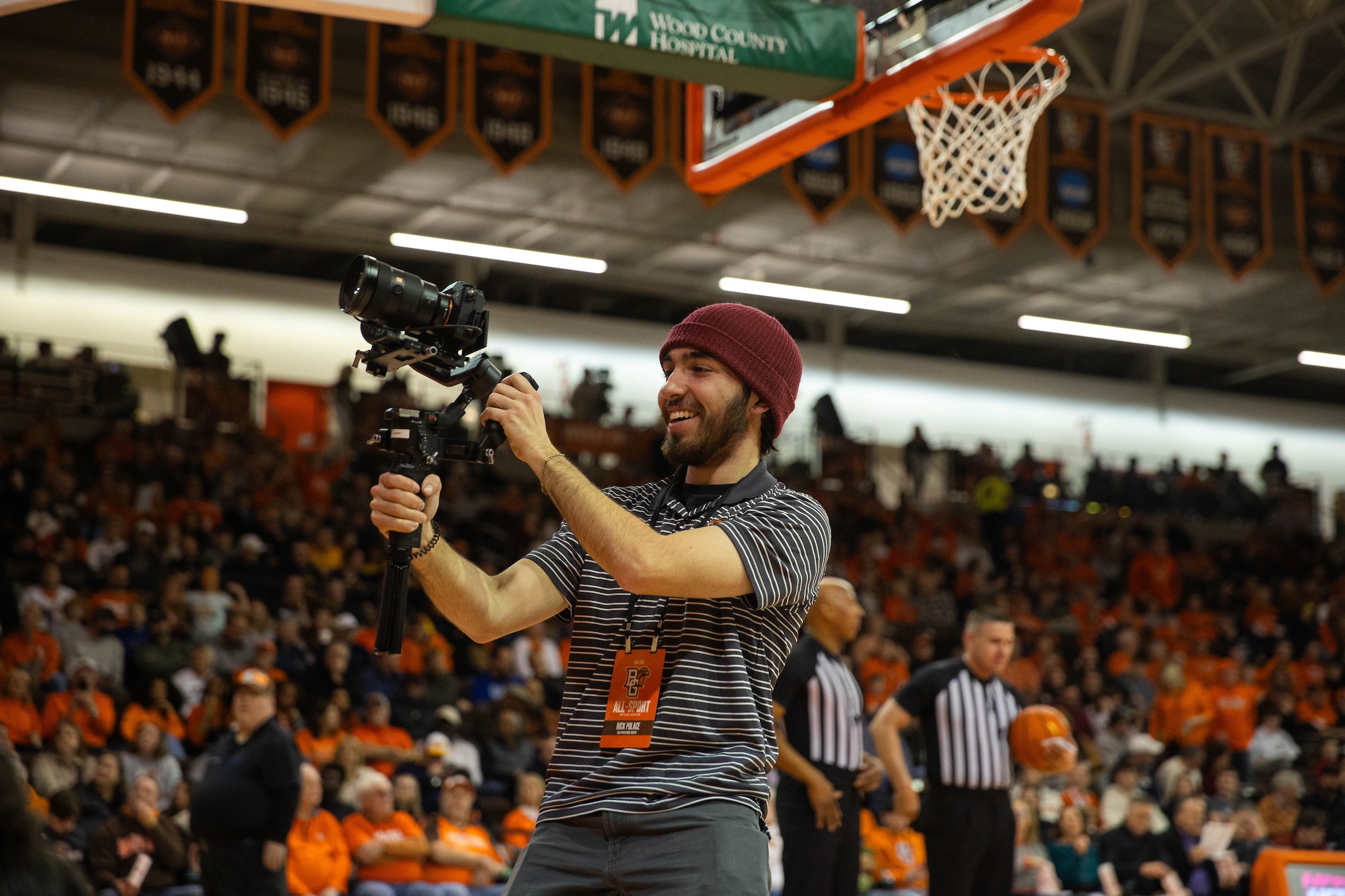 man taking photo at game