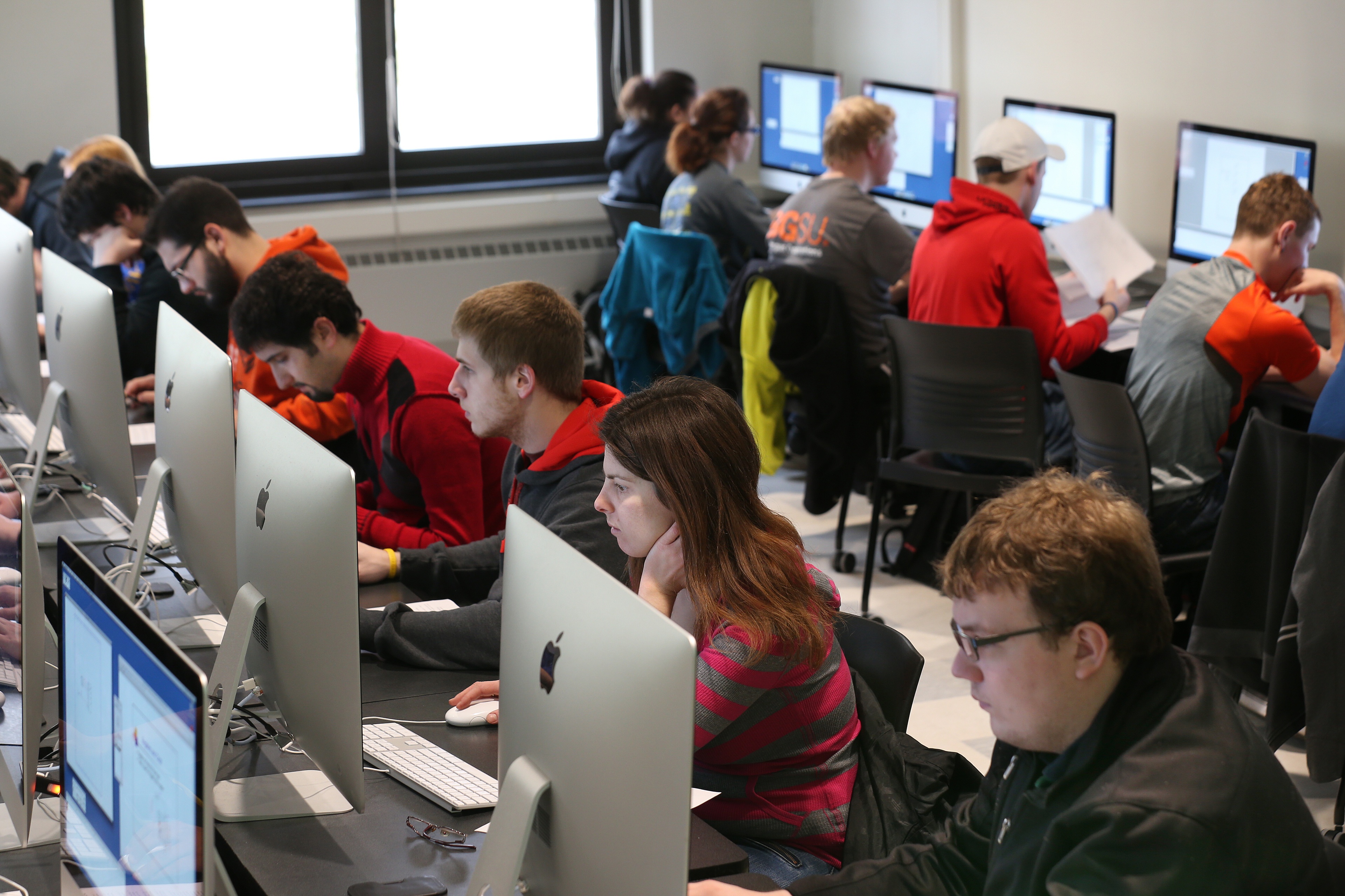 Software engineering students work in a computer lab