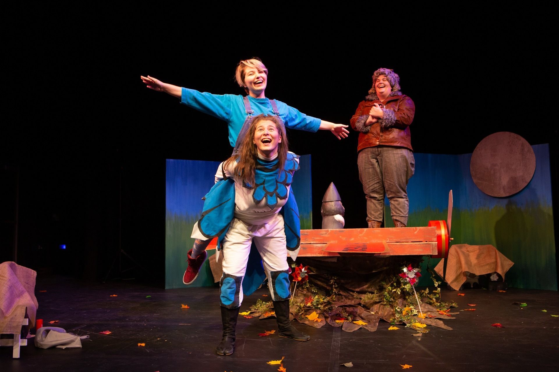 student actors performing in youth theatre production