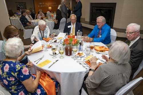 Golden Falcon alumni seated at a table at the 2022 Golden Falcon dinner and reception.