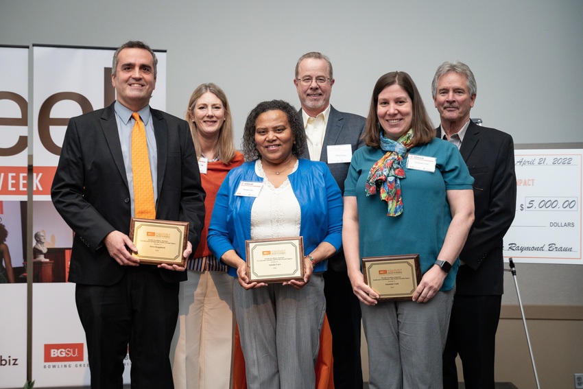 Dr. Steve Koppitsch, Dr. Amelia Carr and Dr. Amanda Cook pose with their awards with members of the Leadership Council.