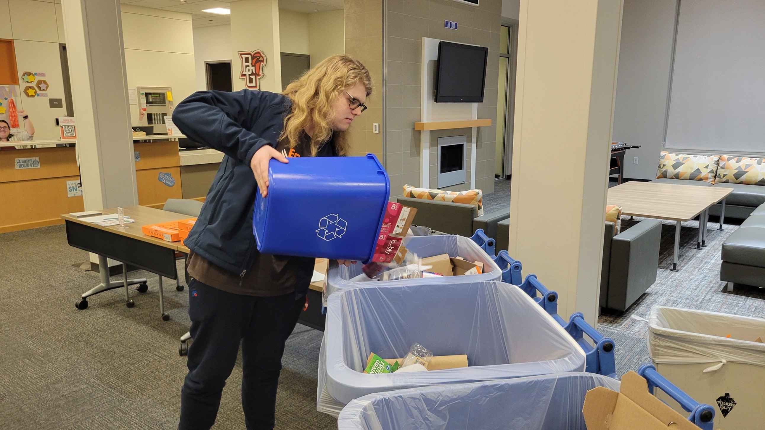 Student in Falcon Heights recycling