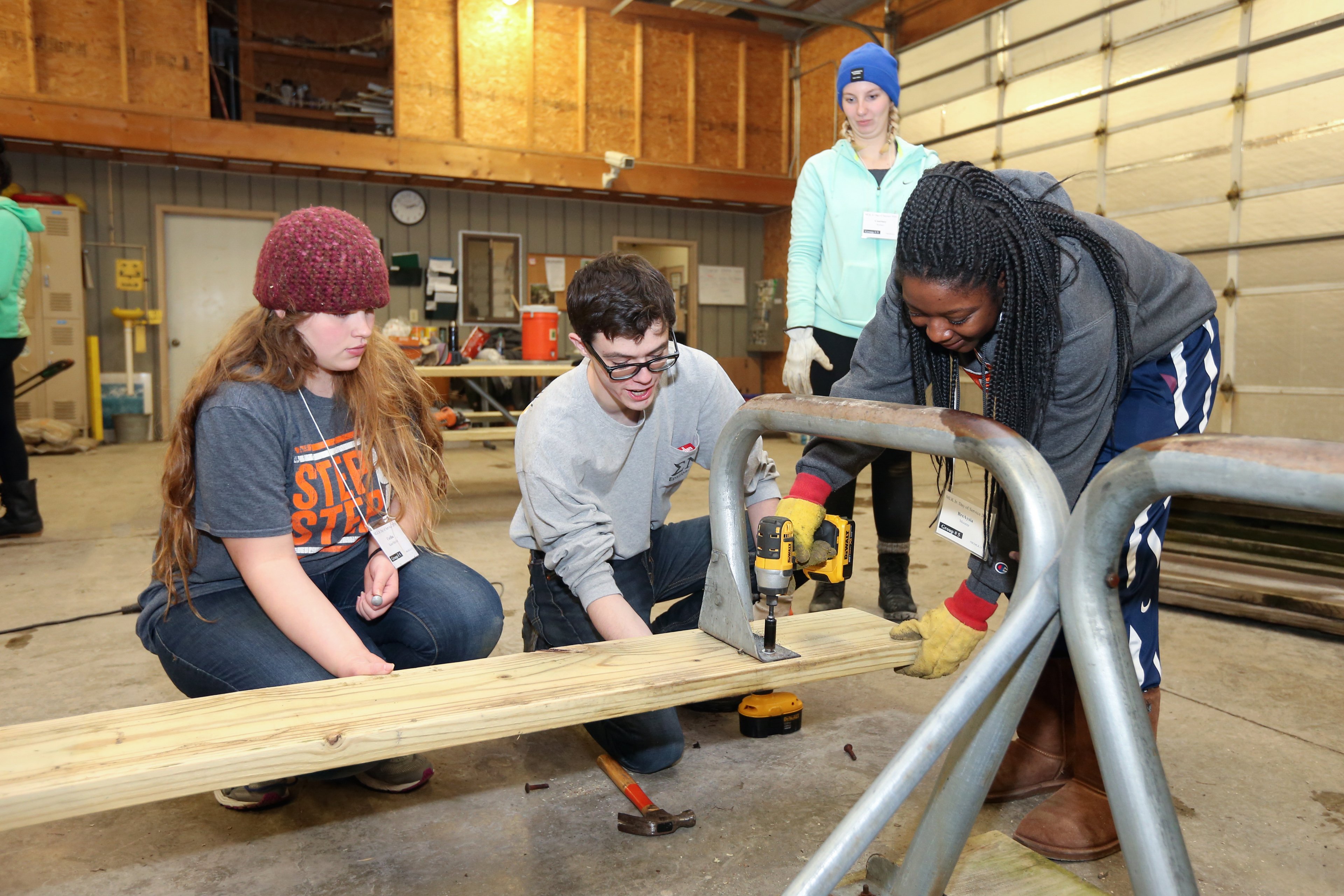 Students build a picnic table at the Wood County Park District during MLK Jr. Day 2018