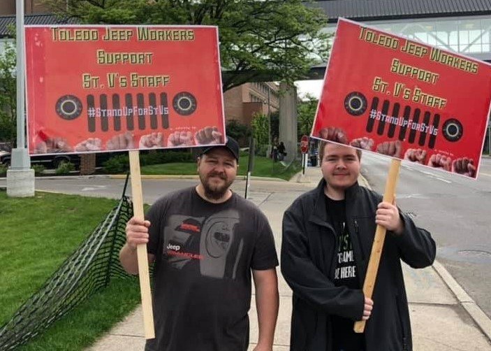 Dan Denton and his son Spenser at a protest