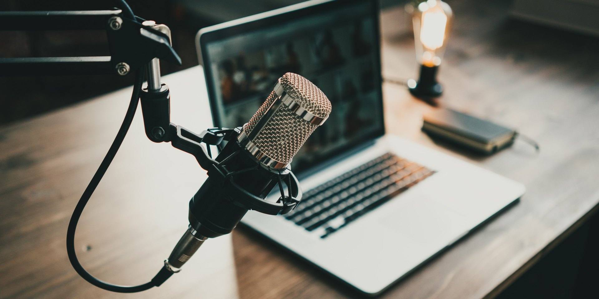 Podcast set-up with microphone and computer 