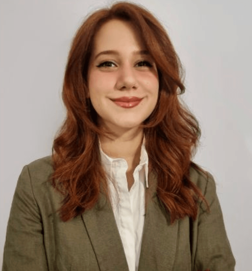 Nilufer wearing a white jacket 