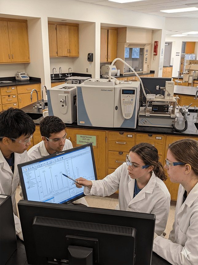 image of students using a GC-MS