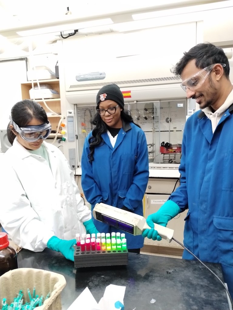 Three Physics grad students in nanoparticles lab