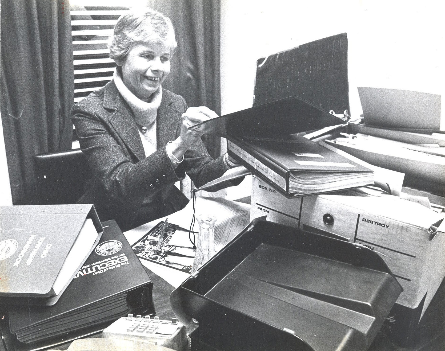 Davidson with books at desk