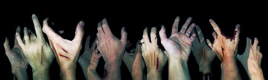 Several zombie hands reaching upwards