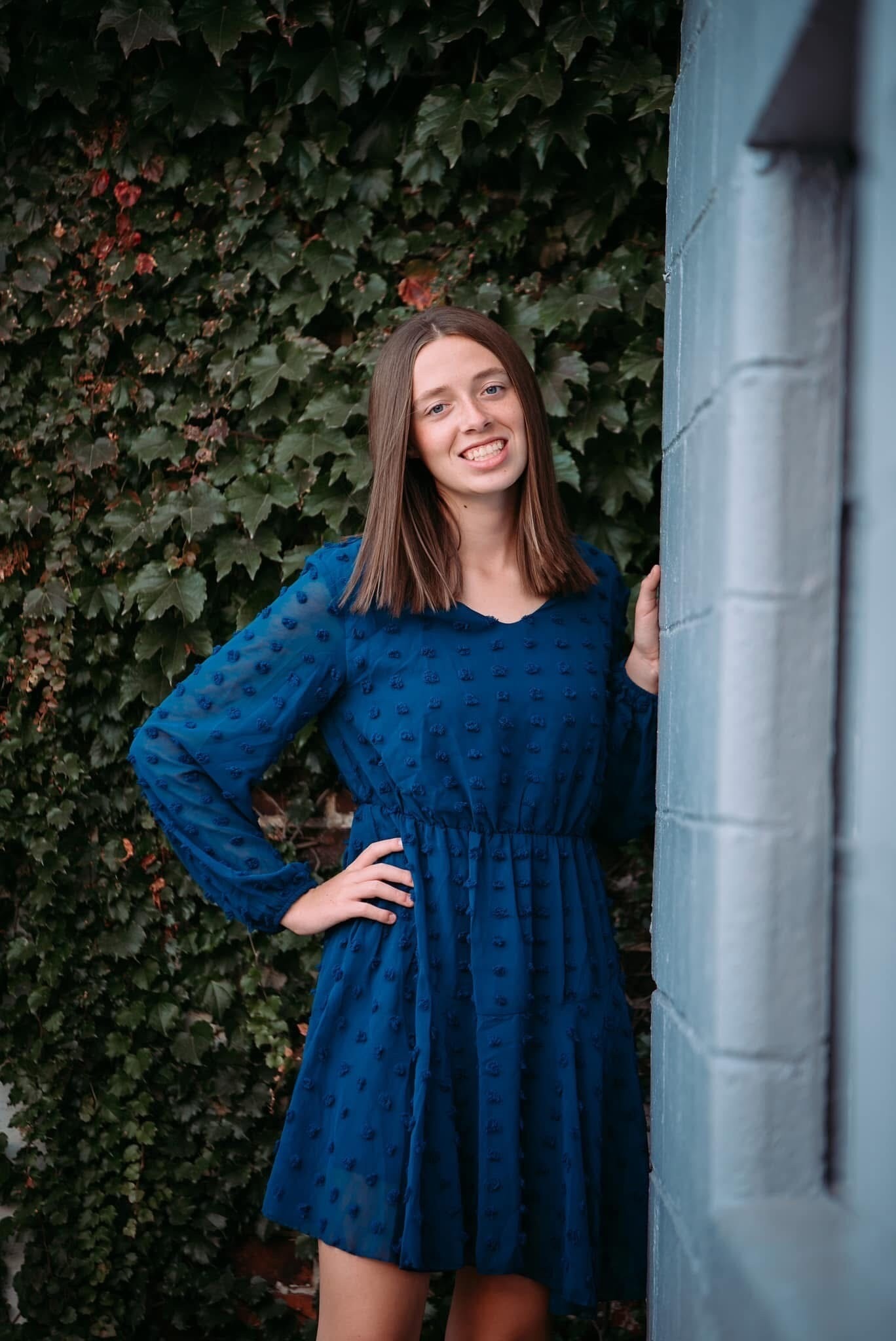 Grace Martin outside with leaves in background