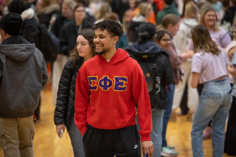 group of students passing out blankets