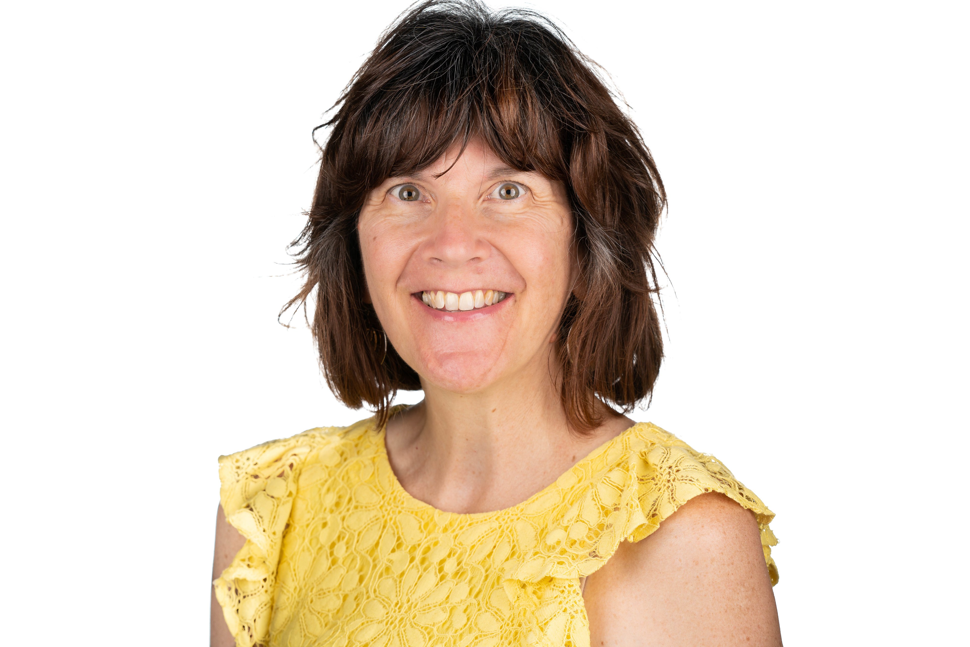 Professional headshot of Amy Lanning wearing a yellow top