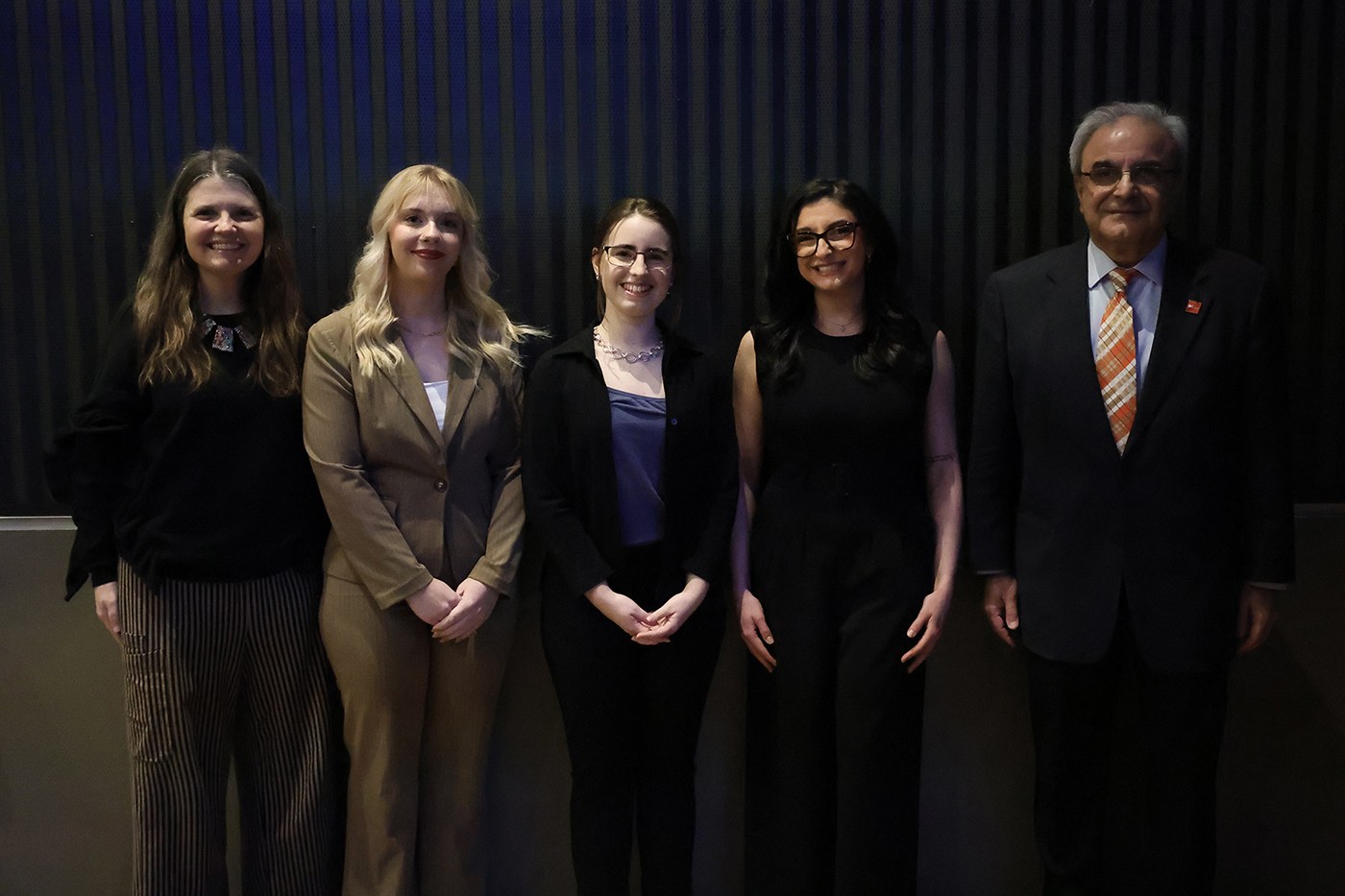 5 people standing for a full length picture.  On the far left Mary Jon Ludy, Associated Dean of the Graduate College.  On the far right Ali Eskandarian, Dean of the Graduate college.