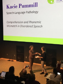 Kacie Pummill receiving award at the 3 Minute Thesis competition at Bowling Green State University