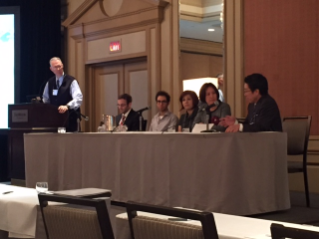 Nick May (leftmost seated person) presented at the 2016 Voice Foundation Symposium with Dr. Scherer moderating (standing at podium)